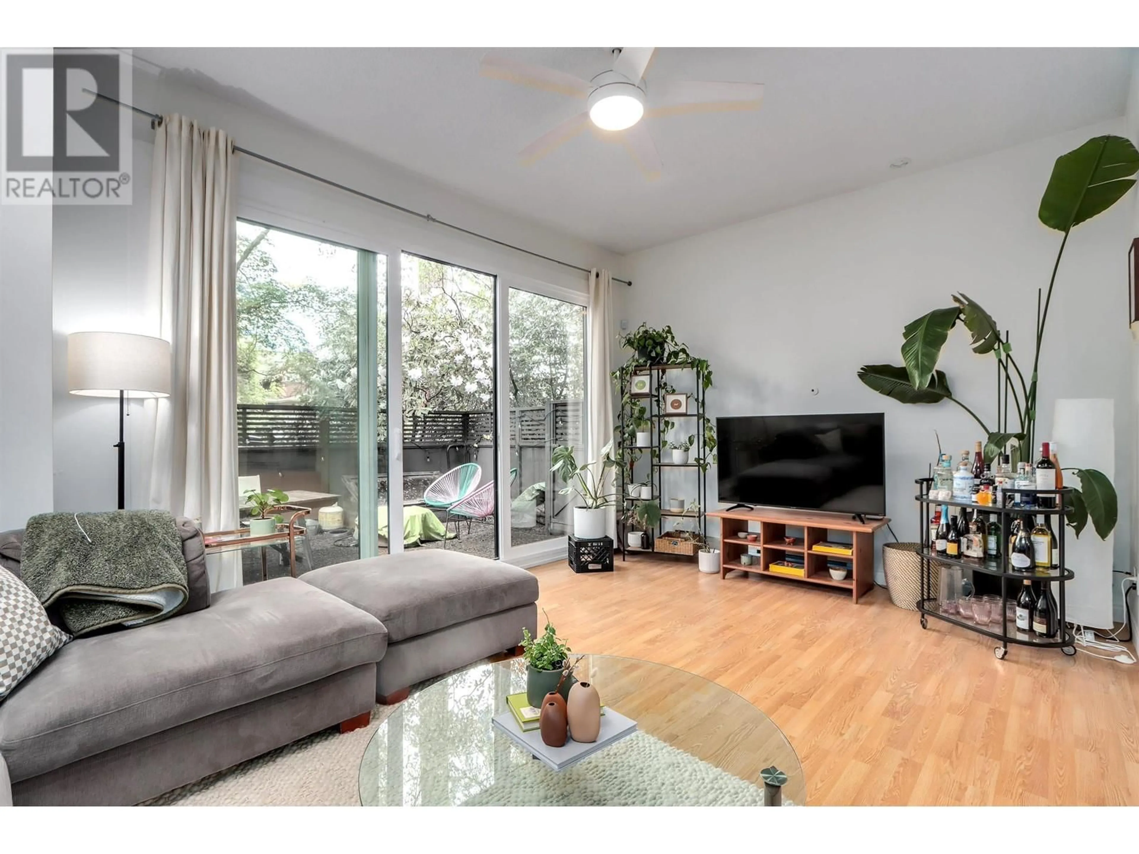Living room with furniture, wood/laminate floor for 1962 15TH AVENUE, Vancouver British Columbia V6J2L3