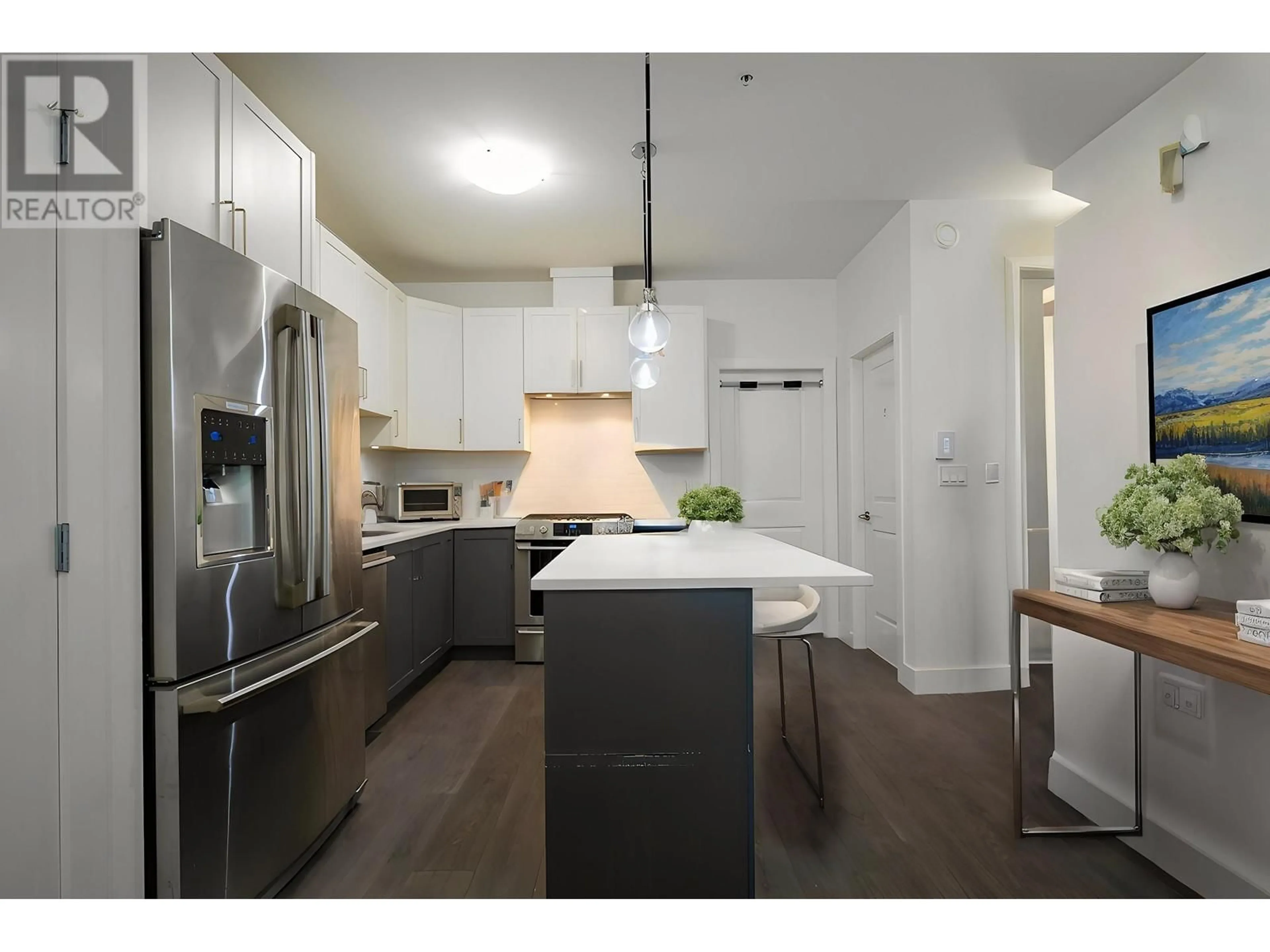 Open concept kitchen, wood/laminate floor for 5805 WALES STREET, Vancouver British Columbia V5R0E6