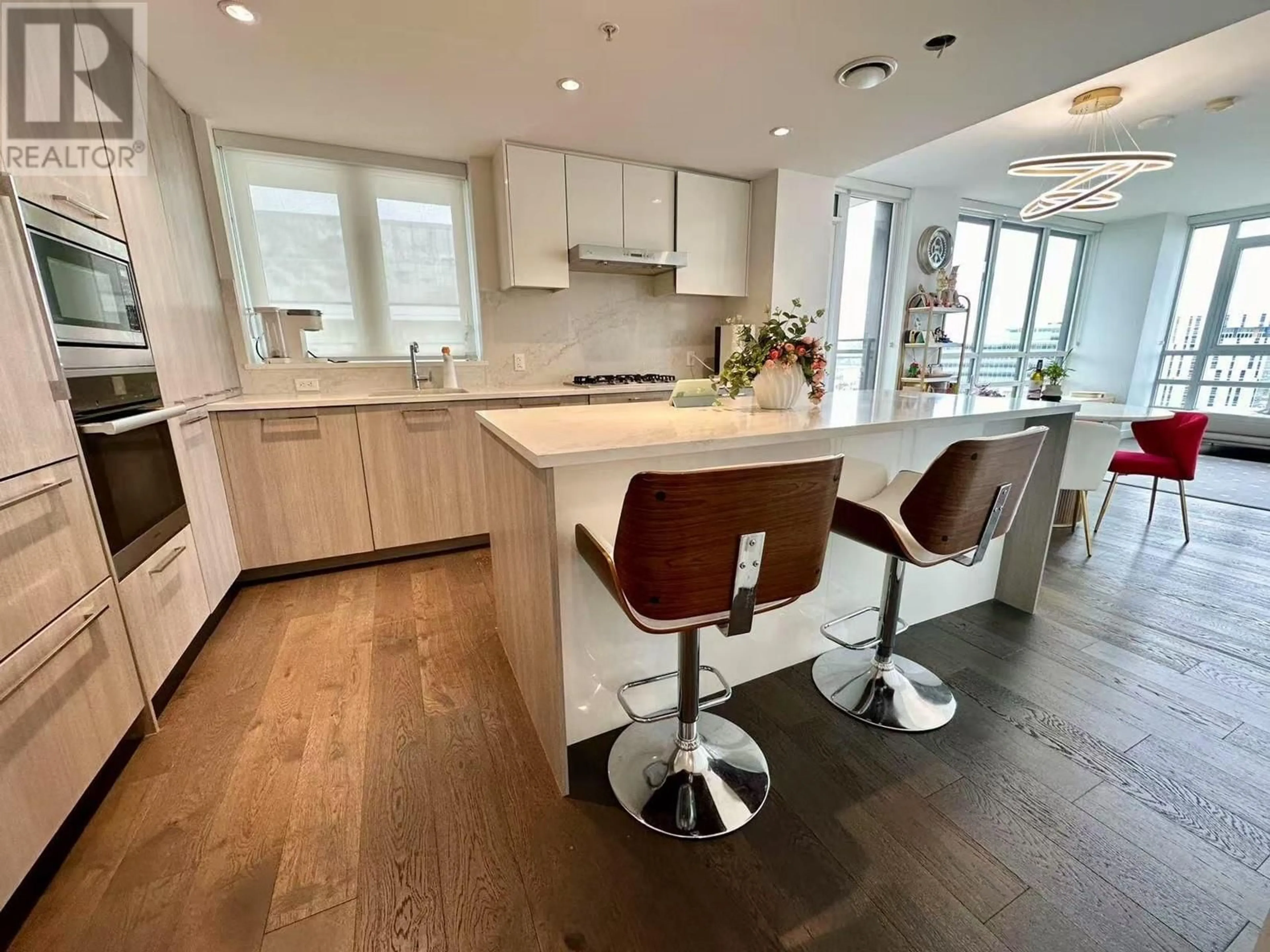 Open concept kitchen, wood/laminate floor for 1305 - 3331 NO. 3 ROAD, Richmond British Columbia V6X2B6