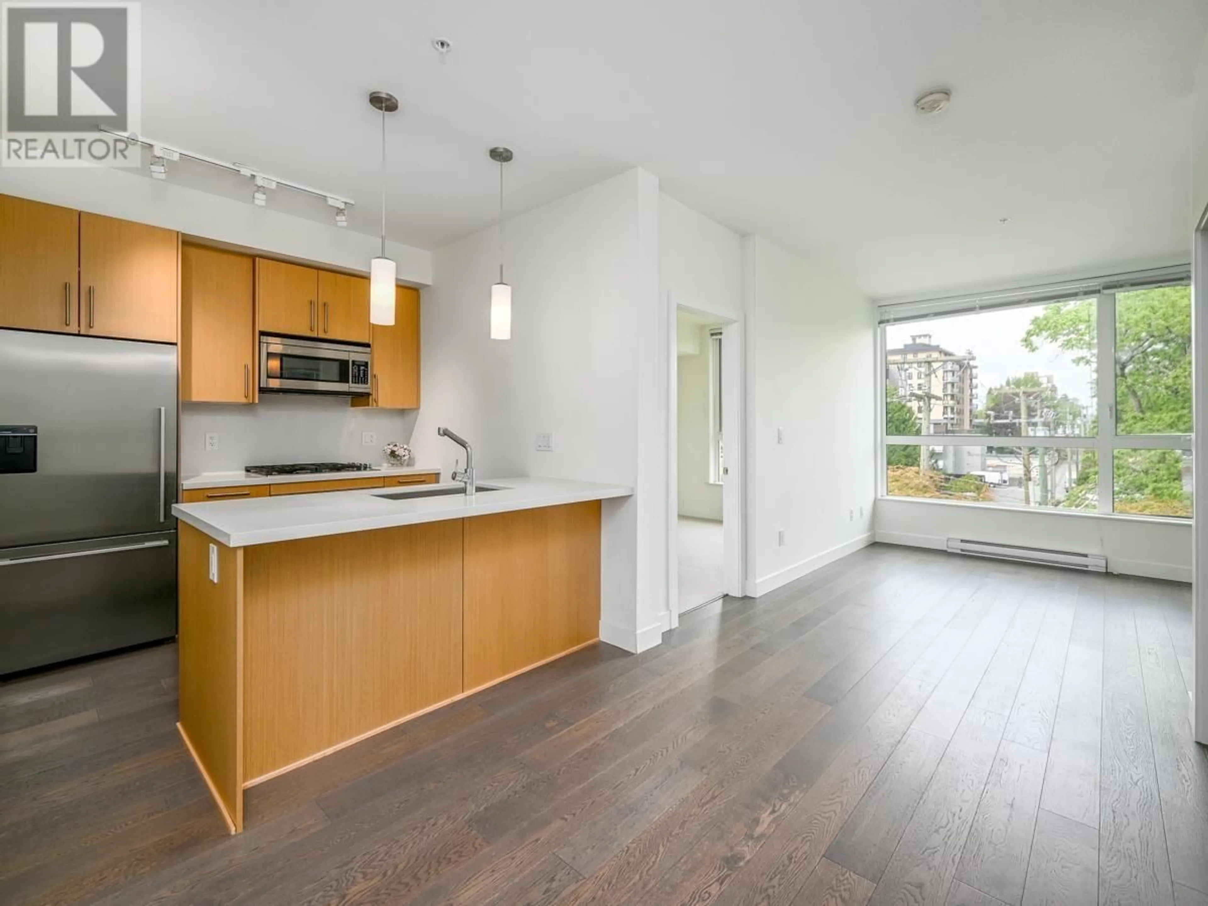 Open concept kitchen, wood/laminate floor for 310 - 5325 WEST BOULEVARD, Vancouver British Columbia V6M3W4