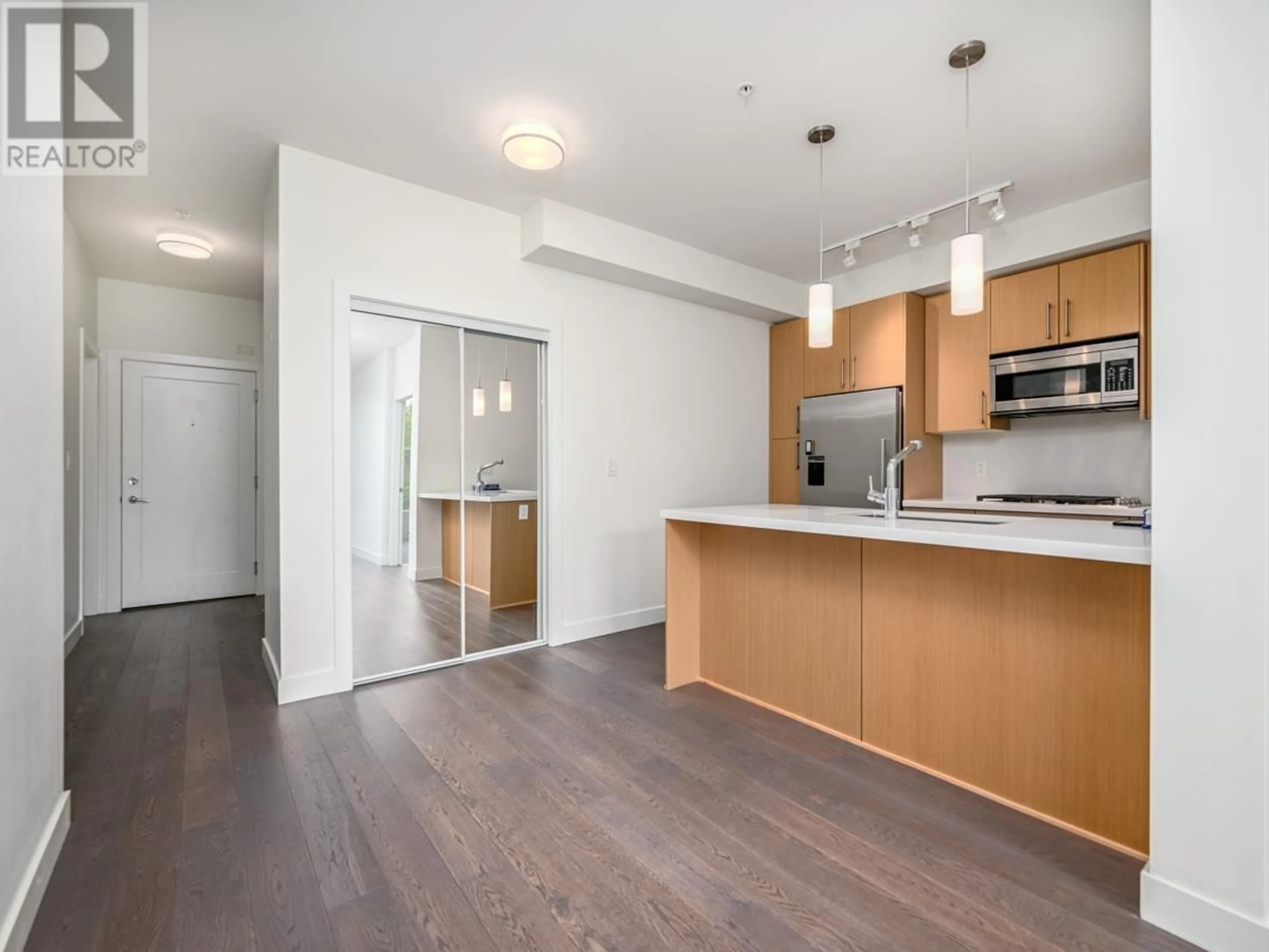 Open concept kitchen, wood/laminate floor for 310 - 5325 WEST BOULEVARD, Vancouver British Columbia V6M3W4