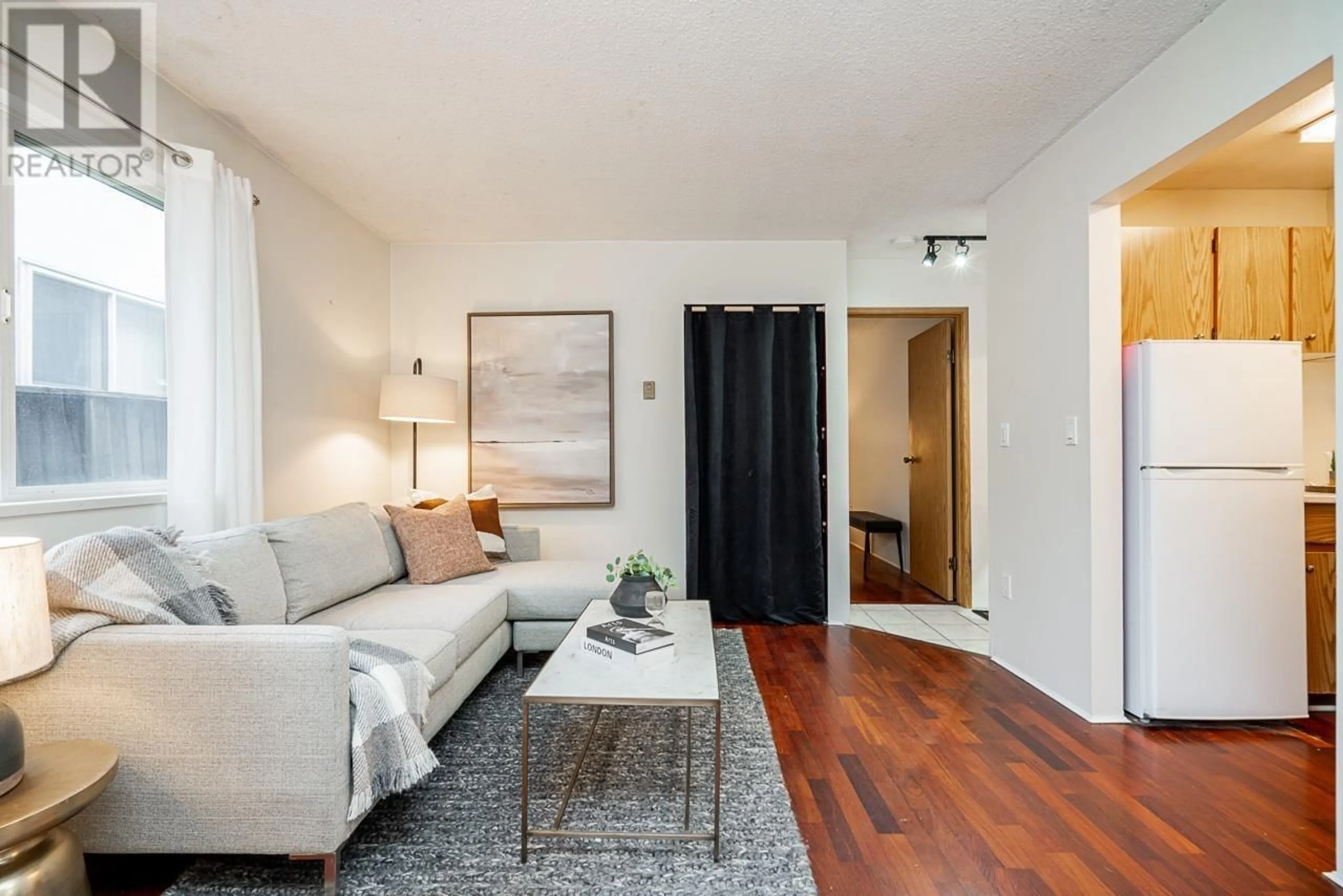 Living room with furniture, wood/laminate floor for 204 - 2239 1ST AVENUE, Vancouver British Columbia V6K1E9