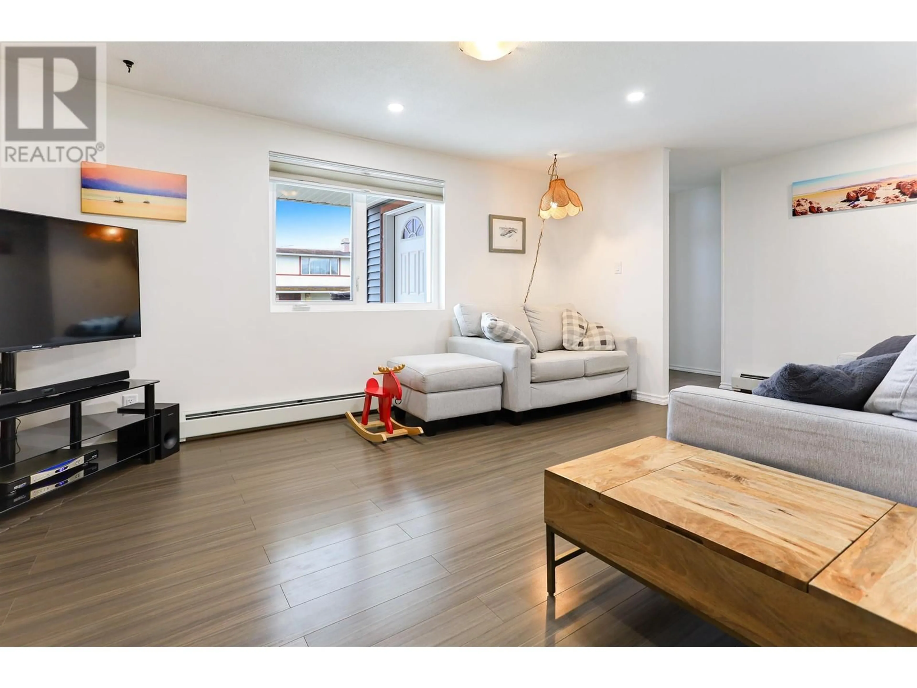 Living room with furniture, wood/laminate floor for 59 CARLSON STREET, Kitimat British Columbia V8C1A9