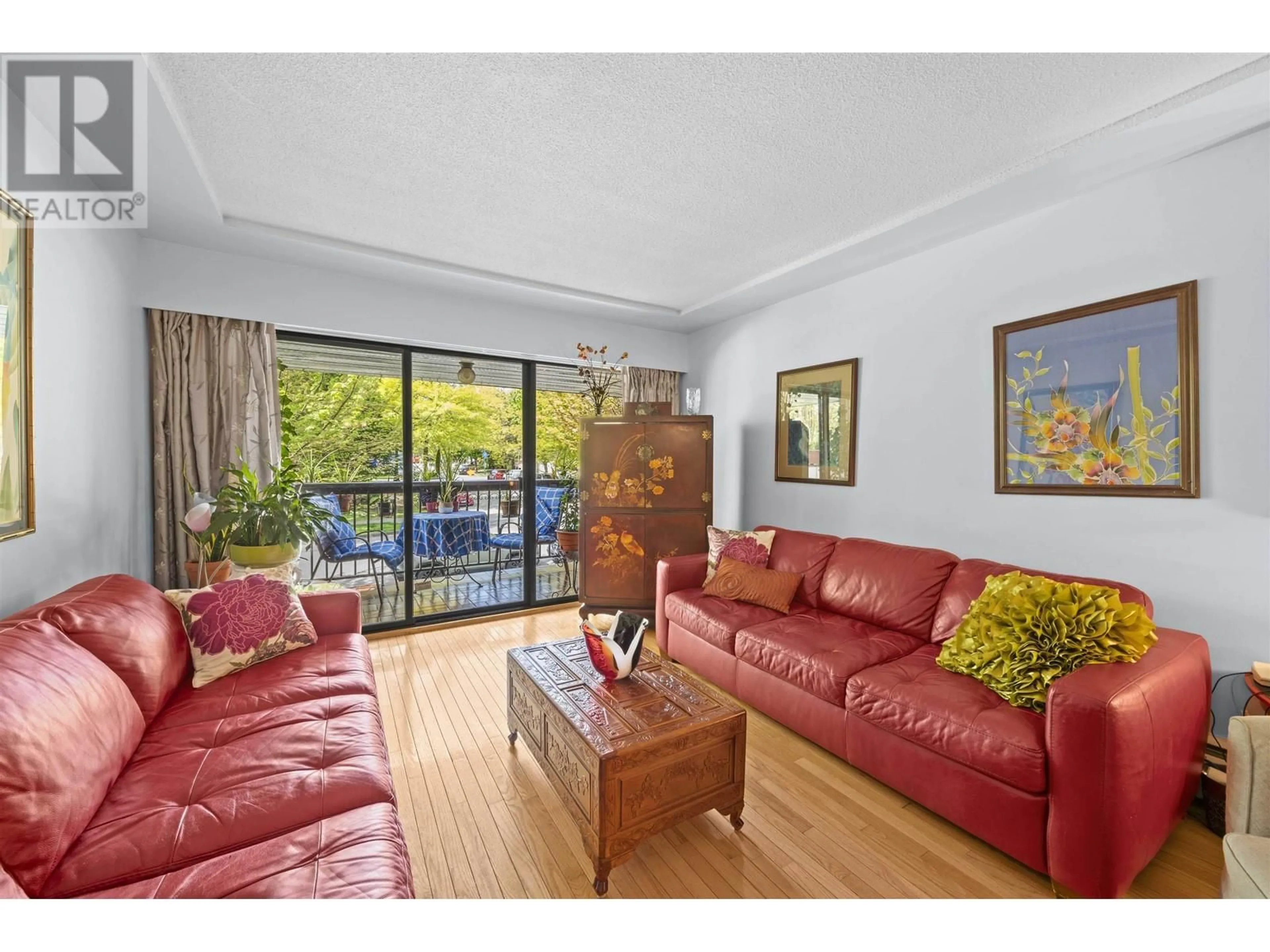 Living room with furniture, wood/laminate floor for 202 - 8770 LAUREL STREET, Vancouver British Columbia V6P3V6