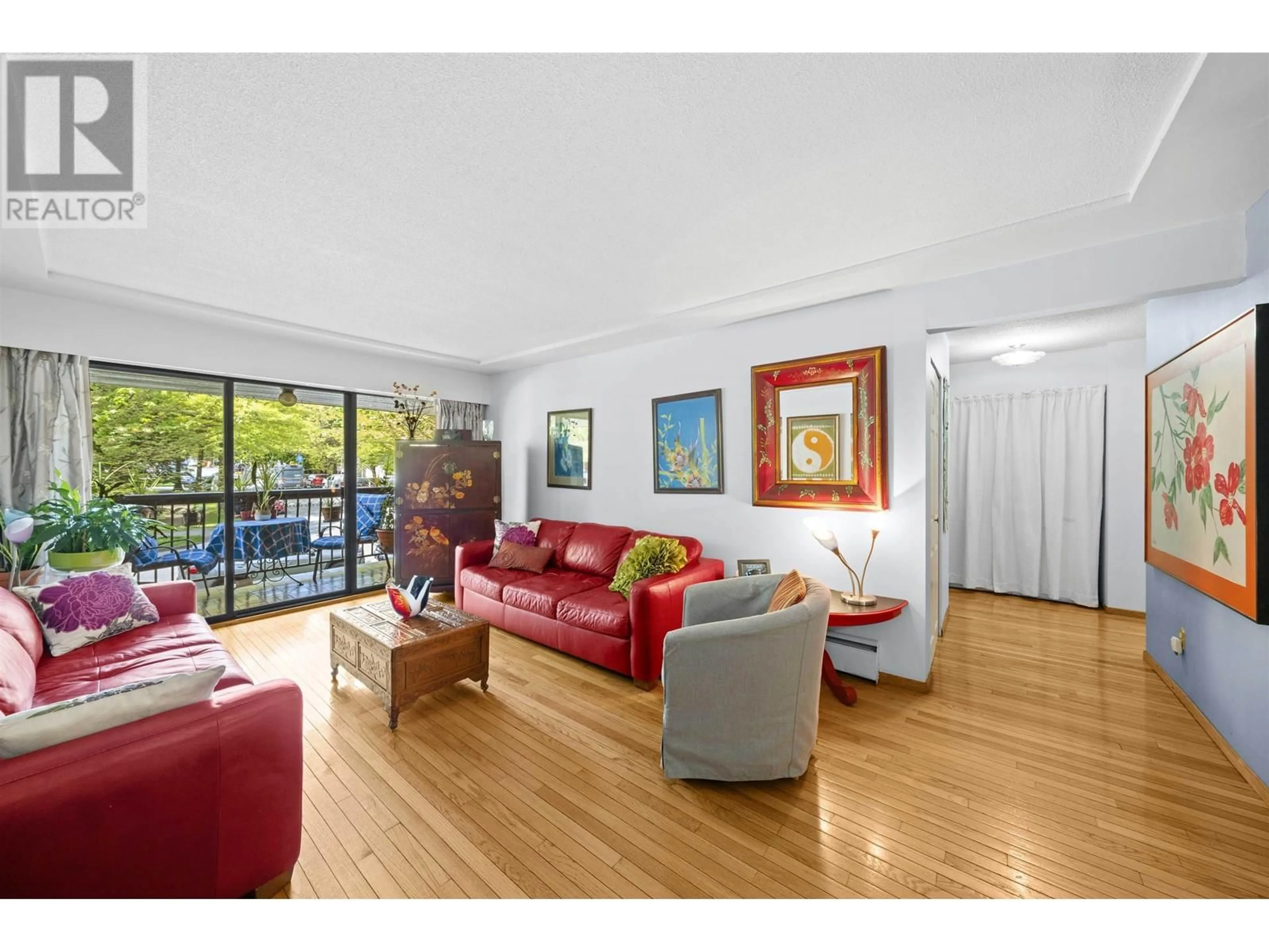 Living room with furniture, wood/laminate floor for 202 - 8770 LAUREL STREET, Vancouver British Columbia V6P3V6