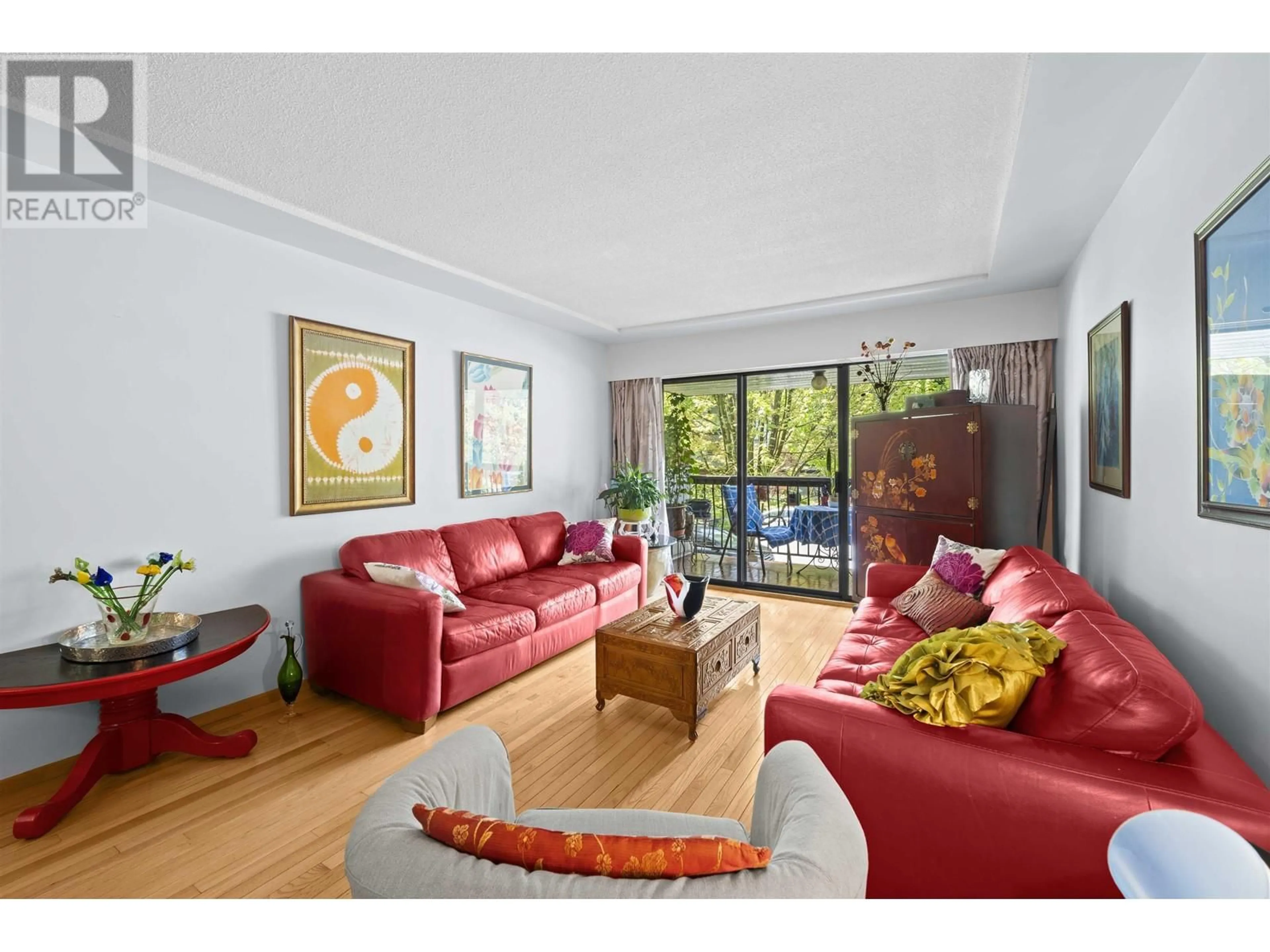 Living room with furniture, wood/laminate floor for 202 - 8770 LAUREL STREET, Vancouver British Columbia V6P3V6