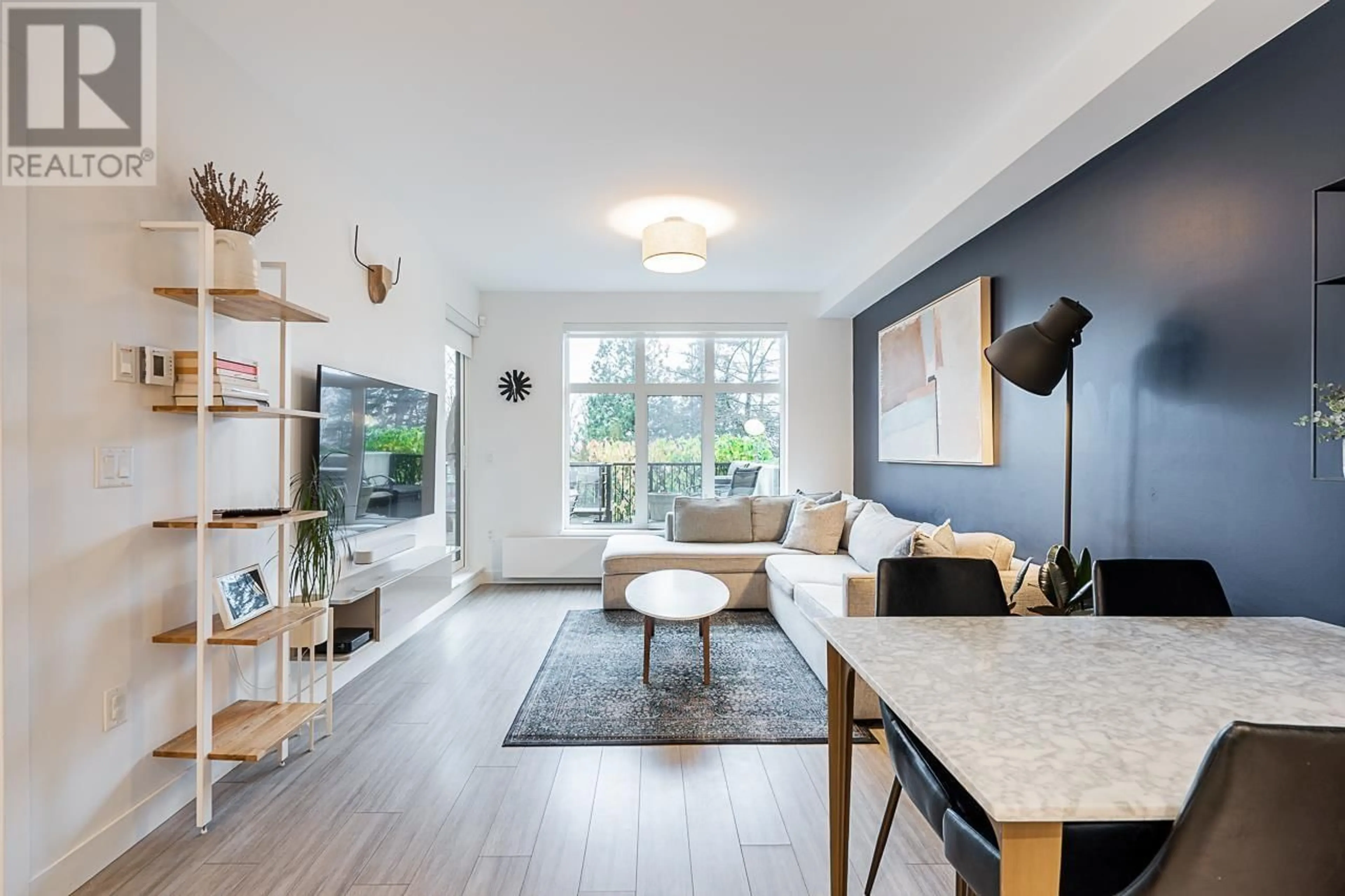 Living room with furniture, wood/laminate floor for 109 - 733 3RD STREET, North Vancouver British Columbia V7L1G8