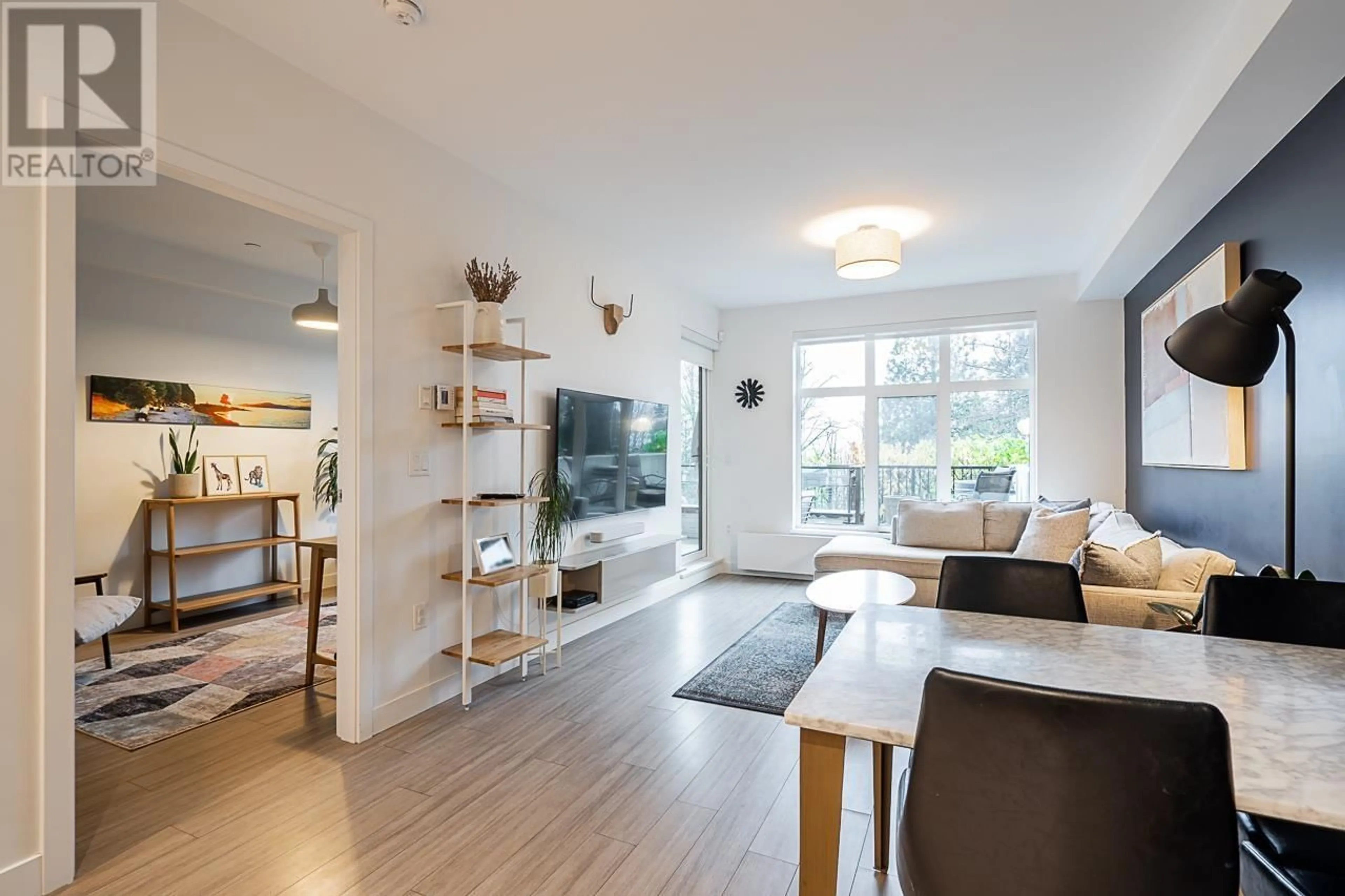 Living room with furniture, wood/laminate floor for 109 - 733 3RD STREET, North Vancouver British Columbia V7L1G8