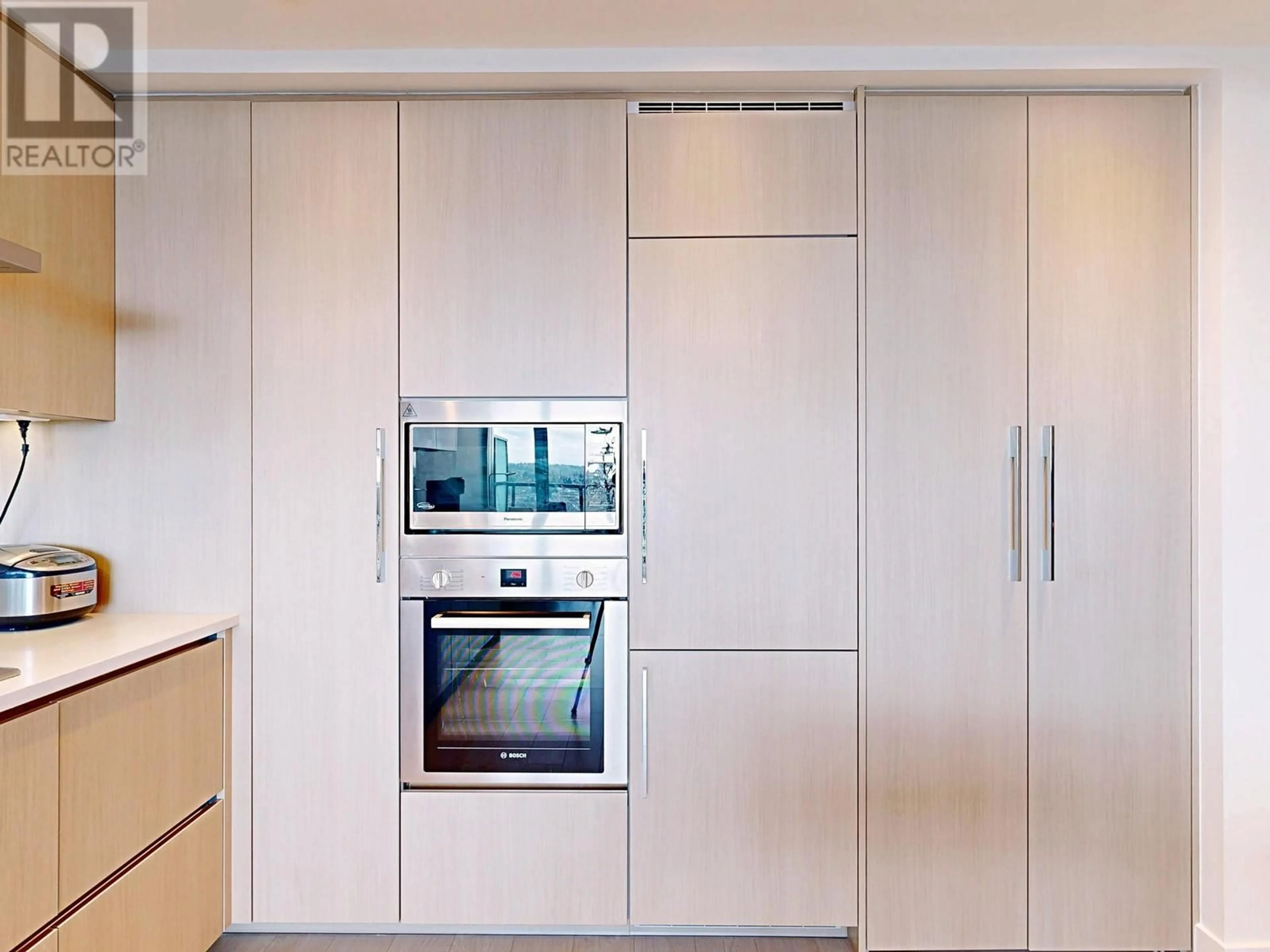 Contemporary kitchen, wood/laminate floor for 2212 - 4730 LOUGHEED HIGHWAY, Burnaby British Columbia V5C0M9