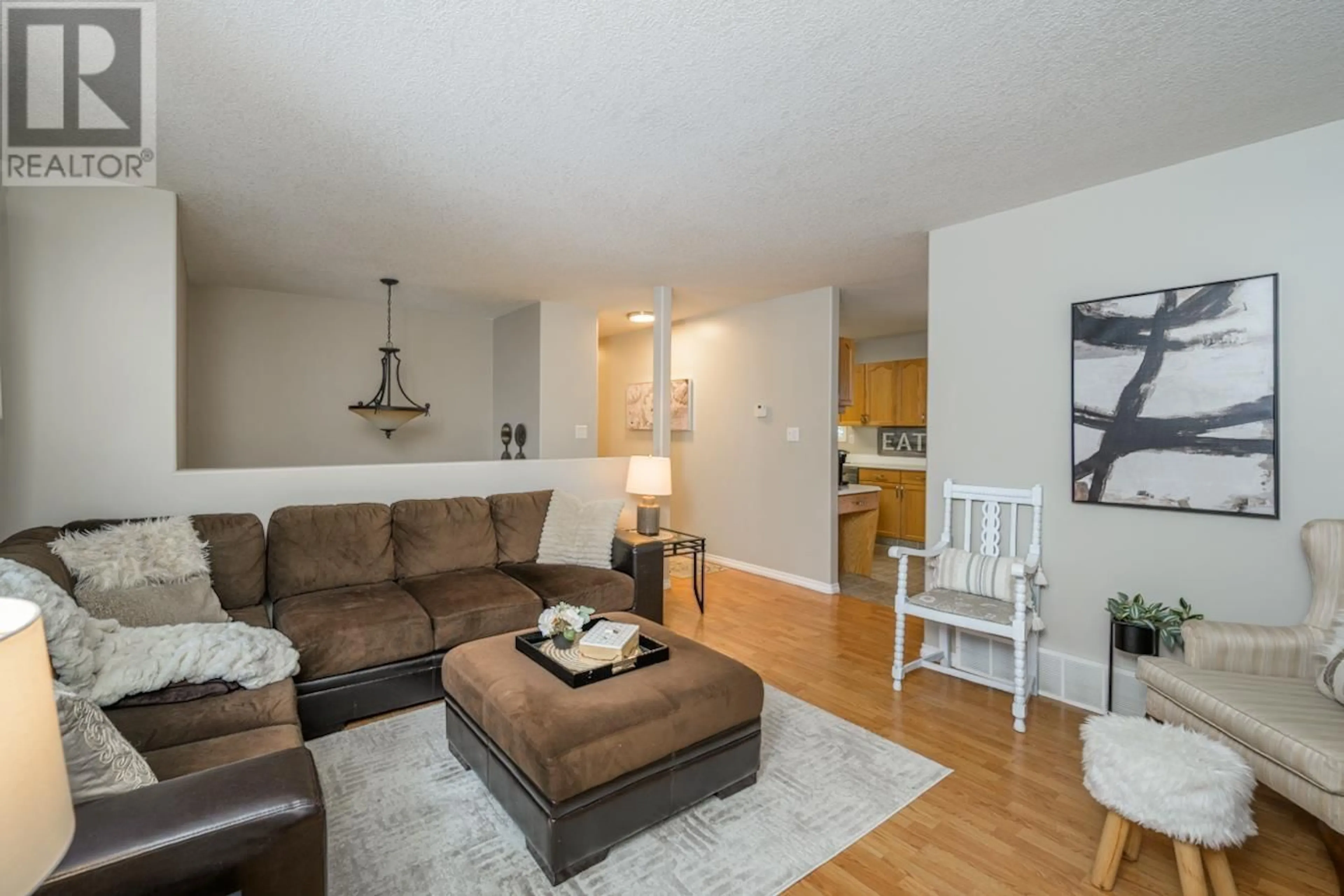 Living room with furniture, wood/laminate floor for 13200 EDOIDGE ROAD, Prince George British Columbia V2K5W8