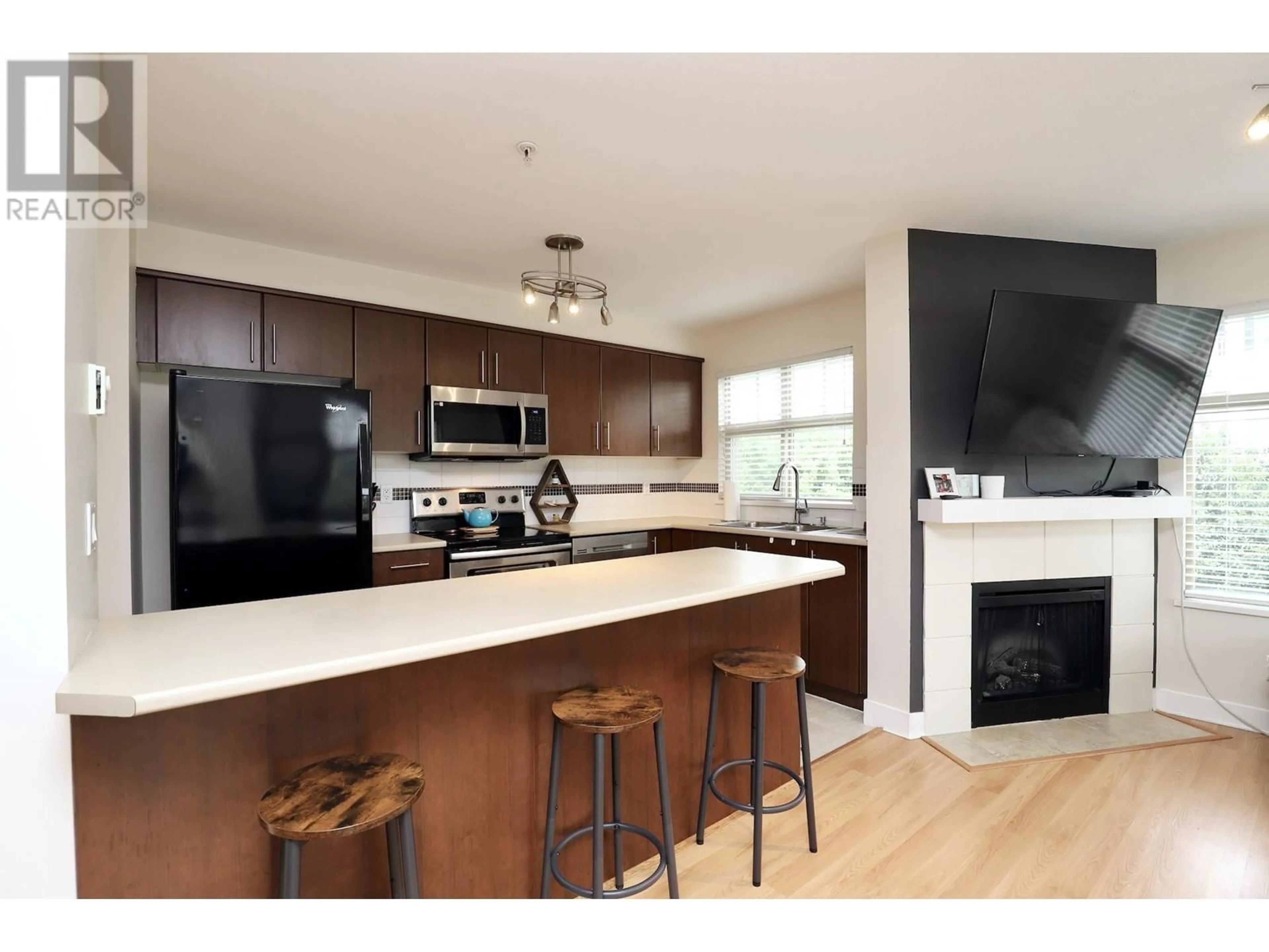 Open concept kitchen, wood/laminate floor for 317 - 12238 224 STREET, Maple Ridge British Columbia V2X8W5