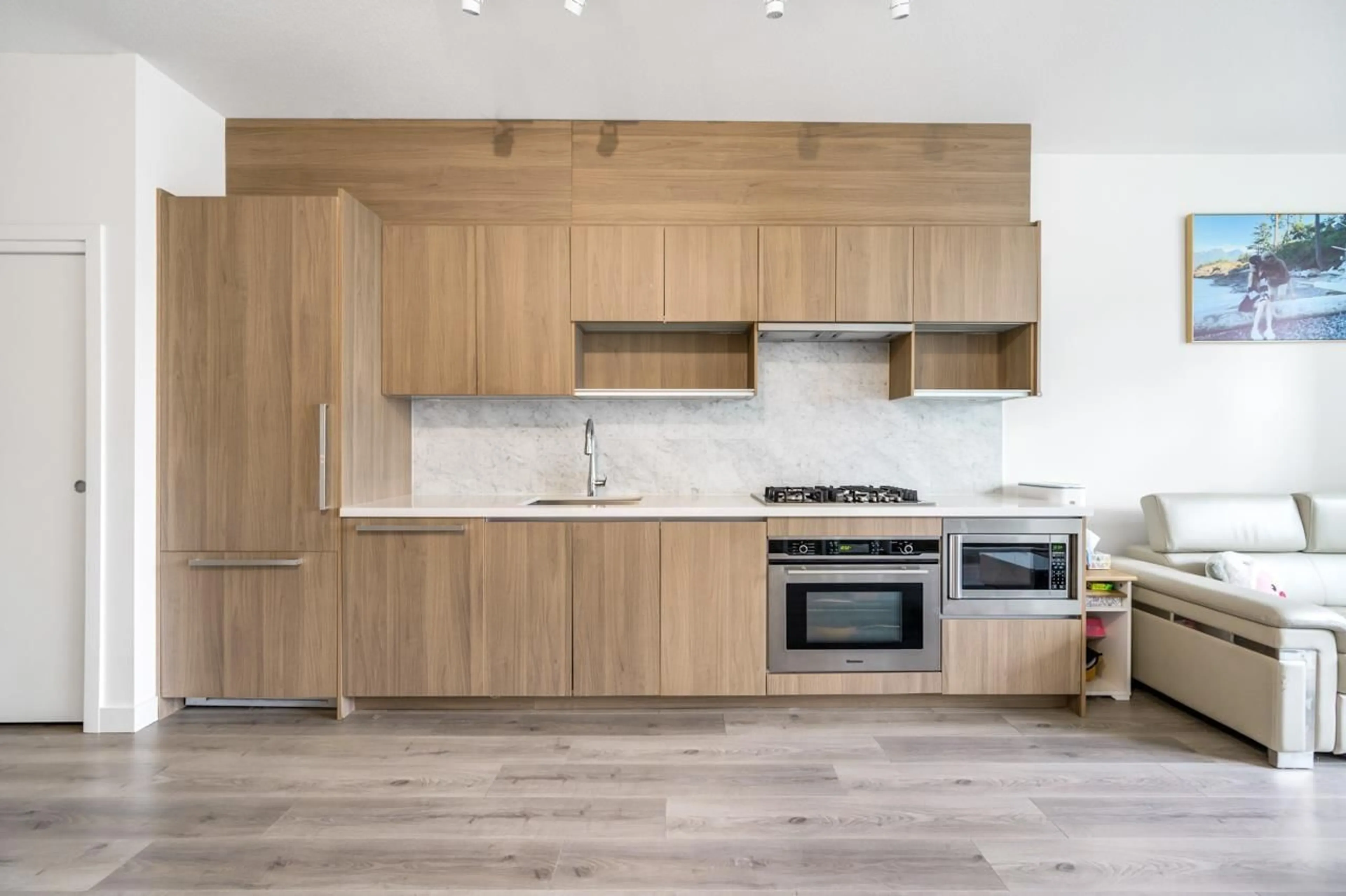 Open concept kitchen, wood/laminate floor for 201 - 13750 100, Surrey British Columbia V3T0L3