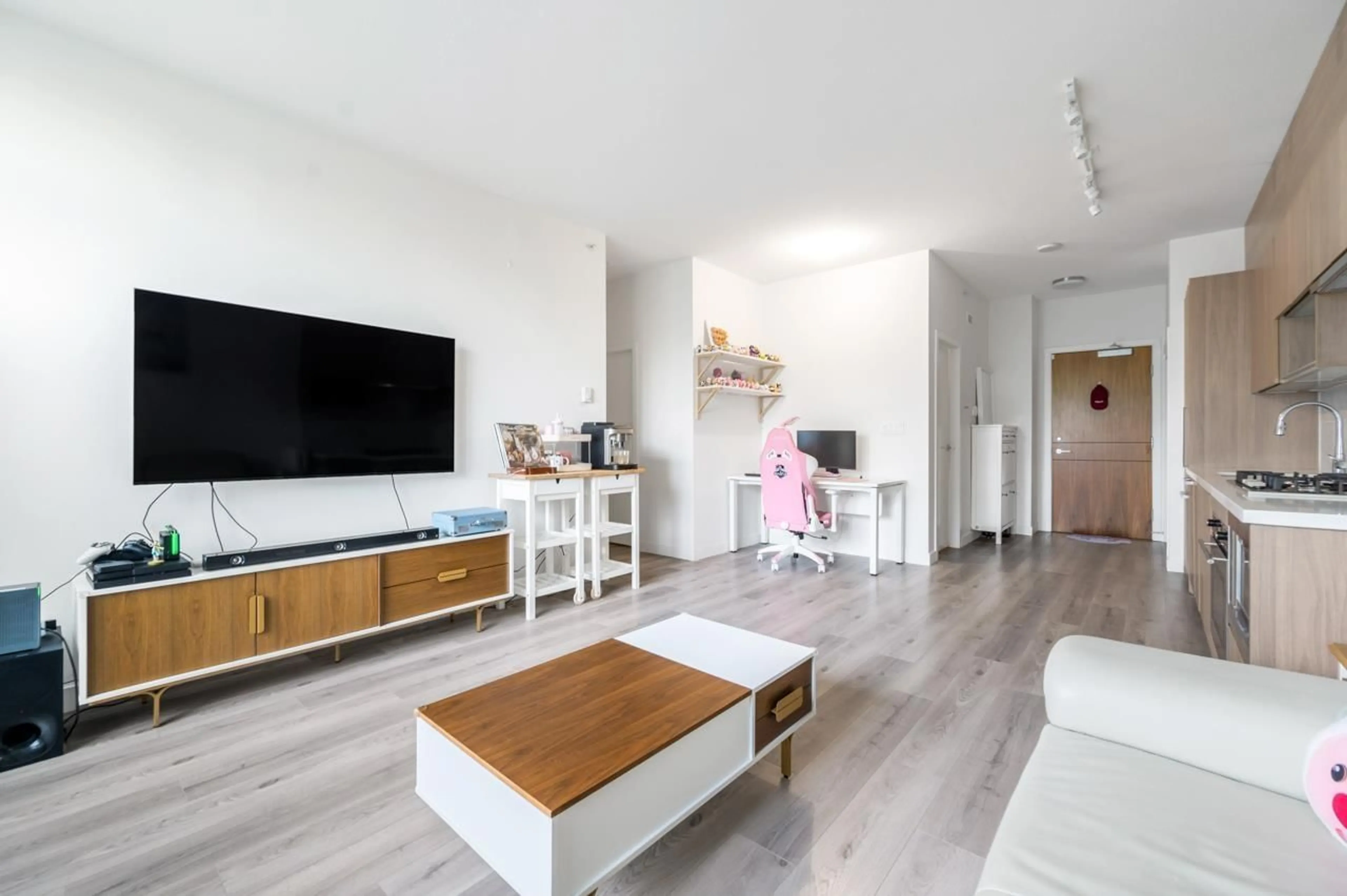 Living room with furniture, wood/laminate floor for 201 - 13750 100, Surrey British Columbia V3T0L3