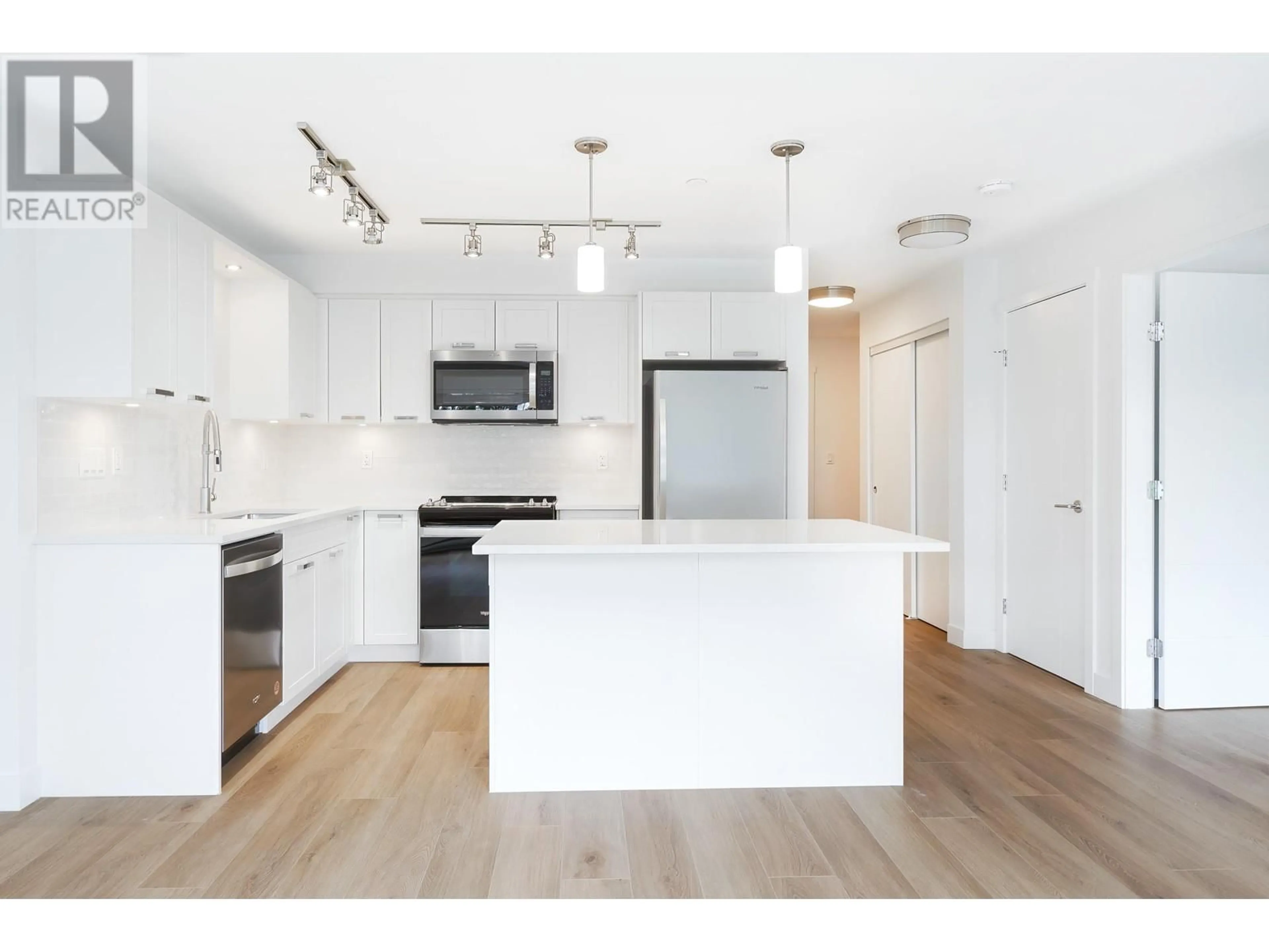 Open concept kitchen, wood/laminate floor for 313 - 22562 121 AVENUE, Maple Ridge British Columbia V2X3Y8