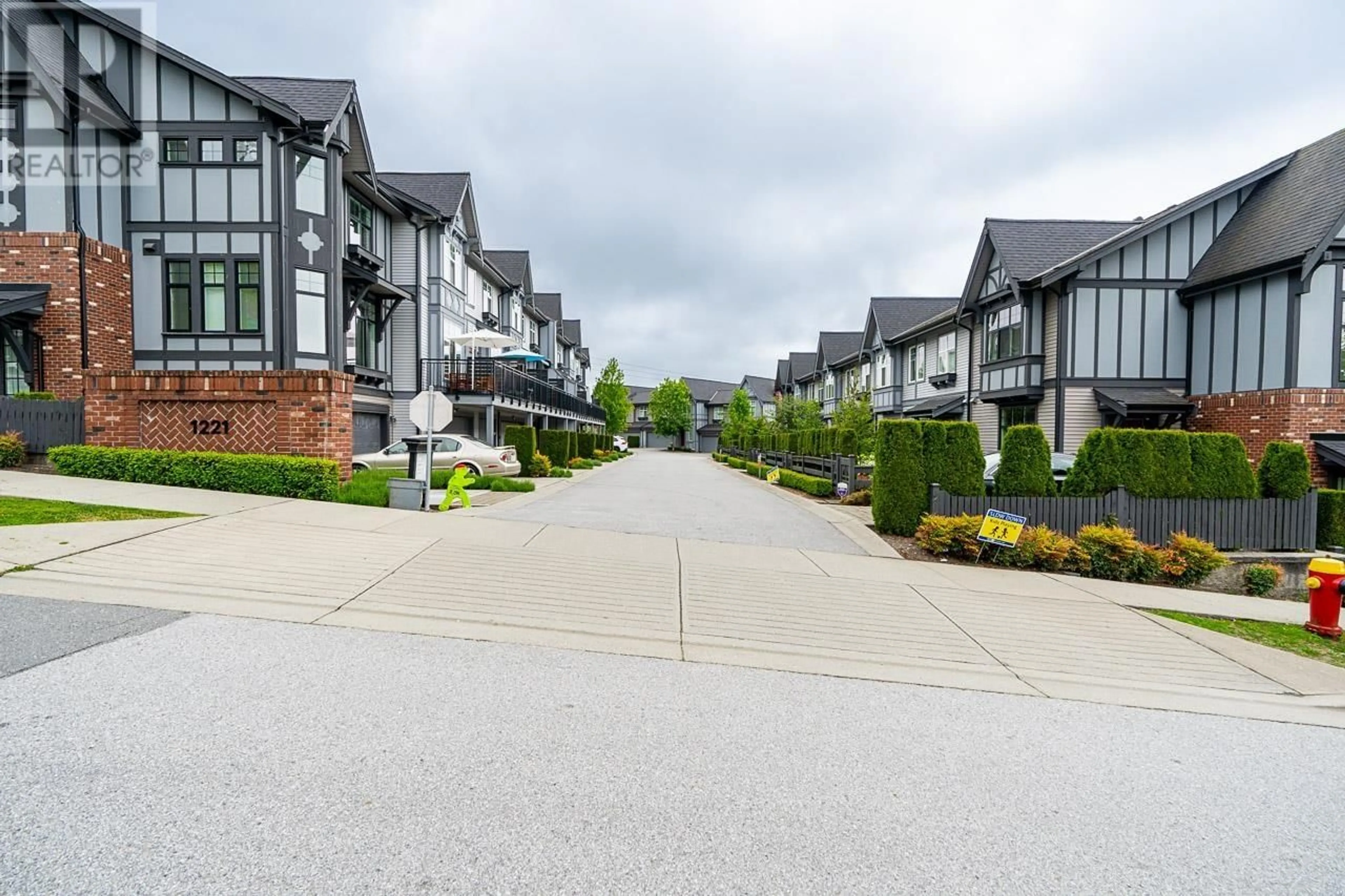 A pic from outside/outdoor area/front of a property/back of a property/a pic from drone, street for 2 - 1221 ROCKLIN STREET, Coquitlam British Columbia V3B0N7