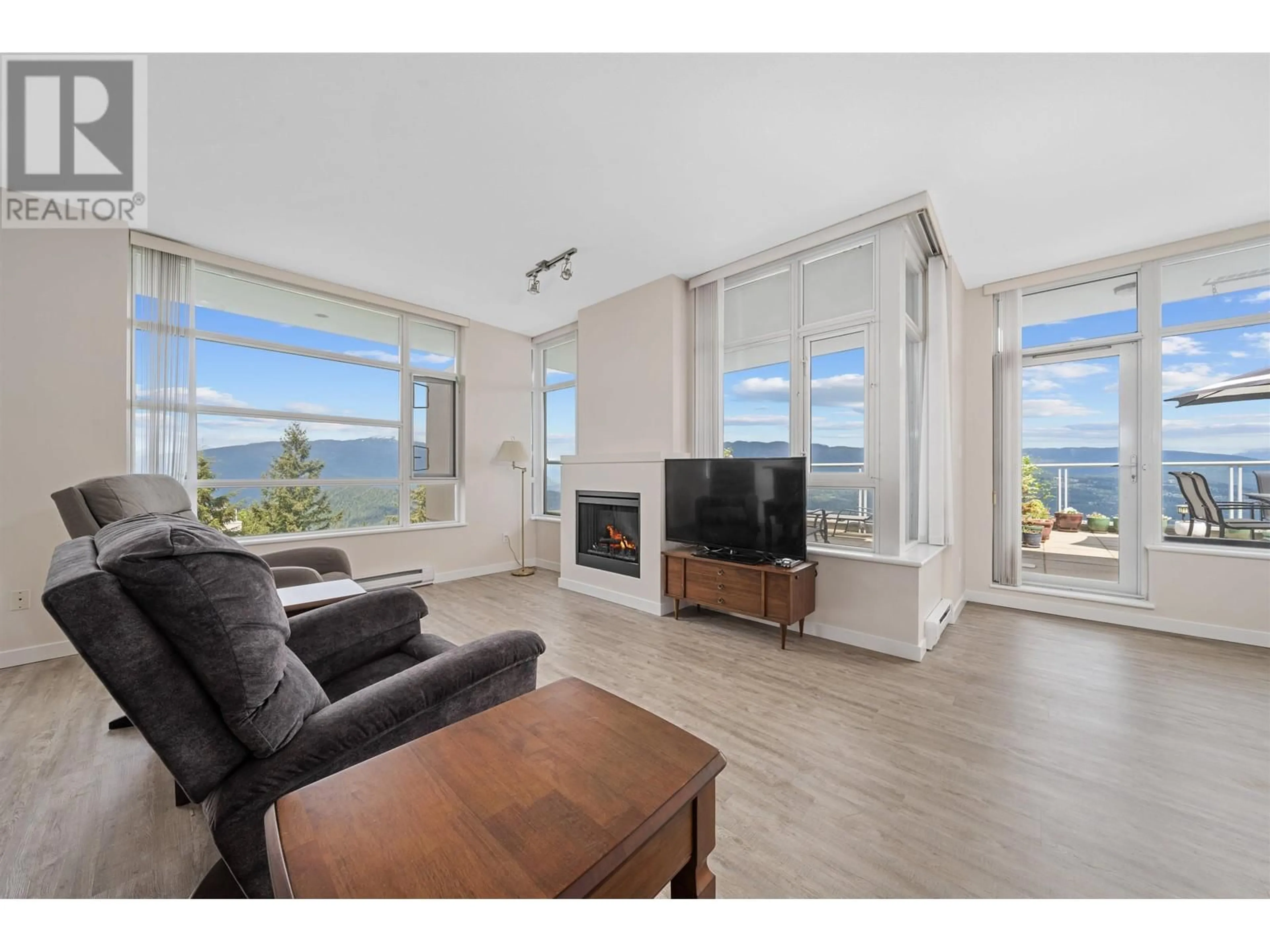 Living room with furniture, wood/laminate floor for 1206 - 9266 UNIVERSITY CRESCENT, Burnaby British Columbia V5A4Z1