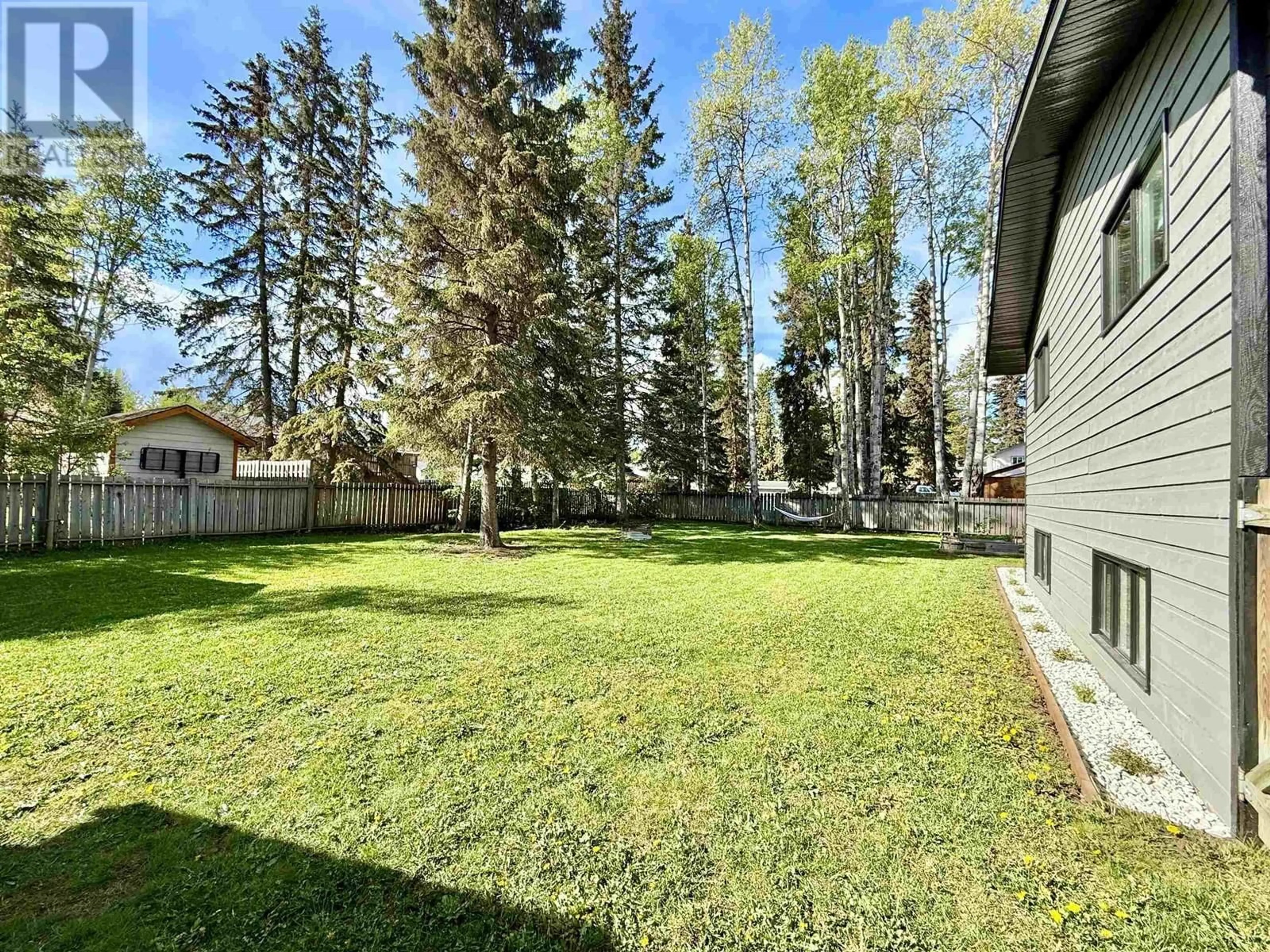 A pic from outside/outdoor area/front of a property/back of a property/a pic from drone, forest/trees view for 1453 WALNUT STREET, Telkwa British Columbia V0J2X0