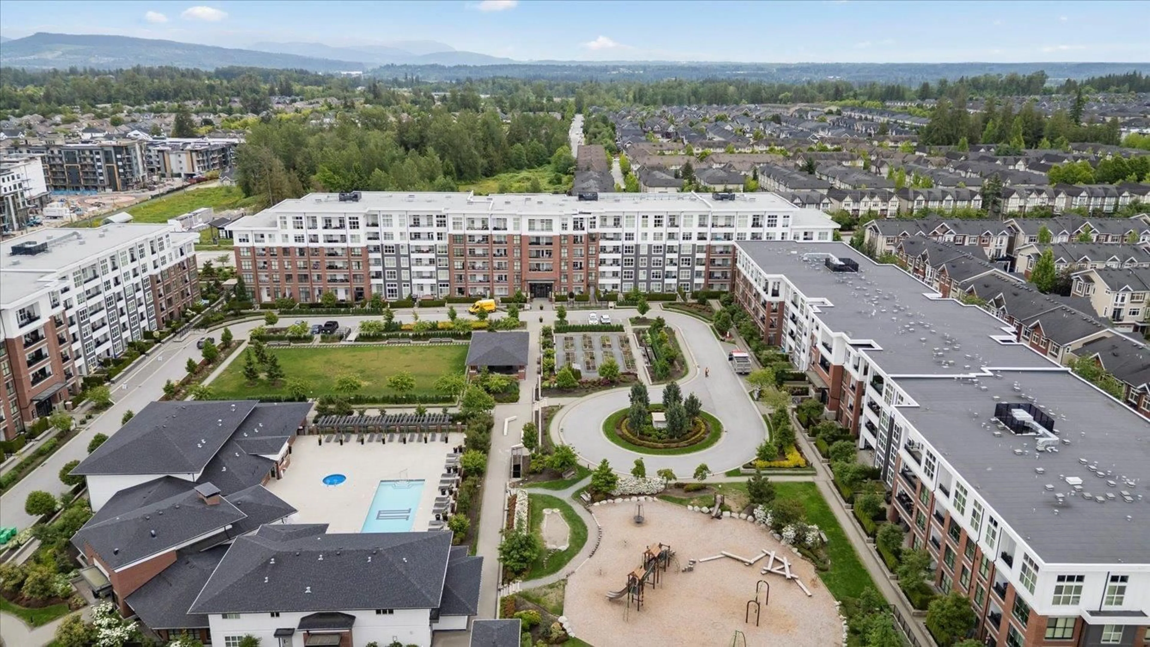 A pic from outside/outdoor area/front of a property/back of a property/a pic from drone, unknown for C614 - 8150 207, Langley British Columbia V2Y4J4