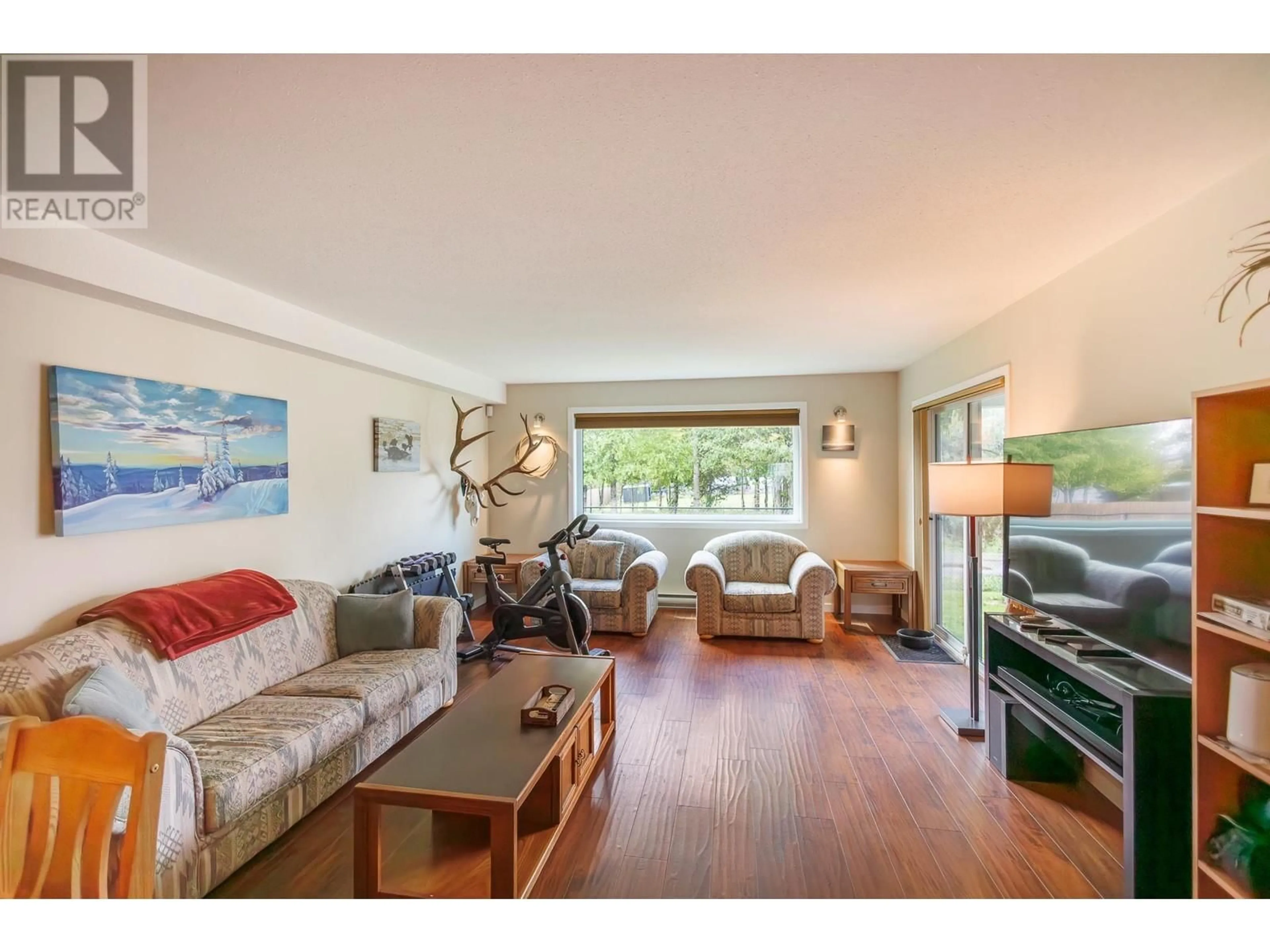 Living room with furniture, wood/laminate floor for 106 - 4719 DAVIS AVENUE, Terrace British Columbia V8G1Y1