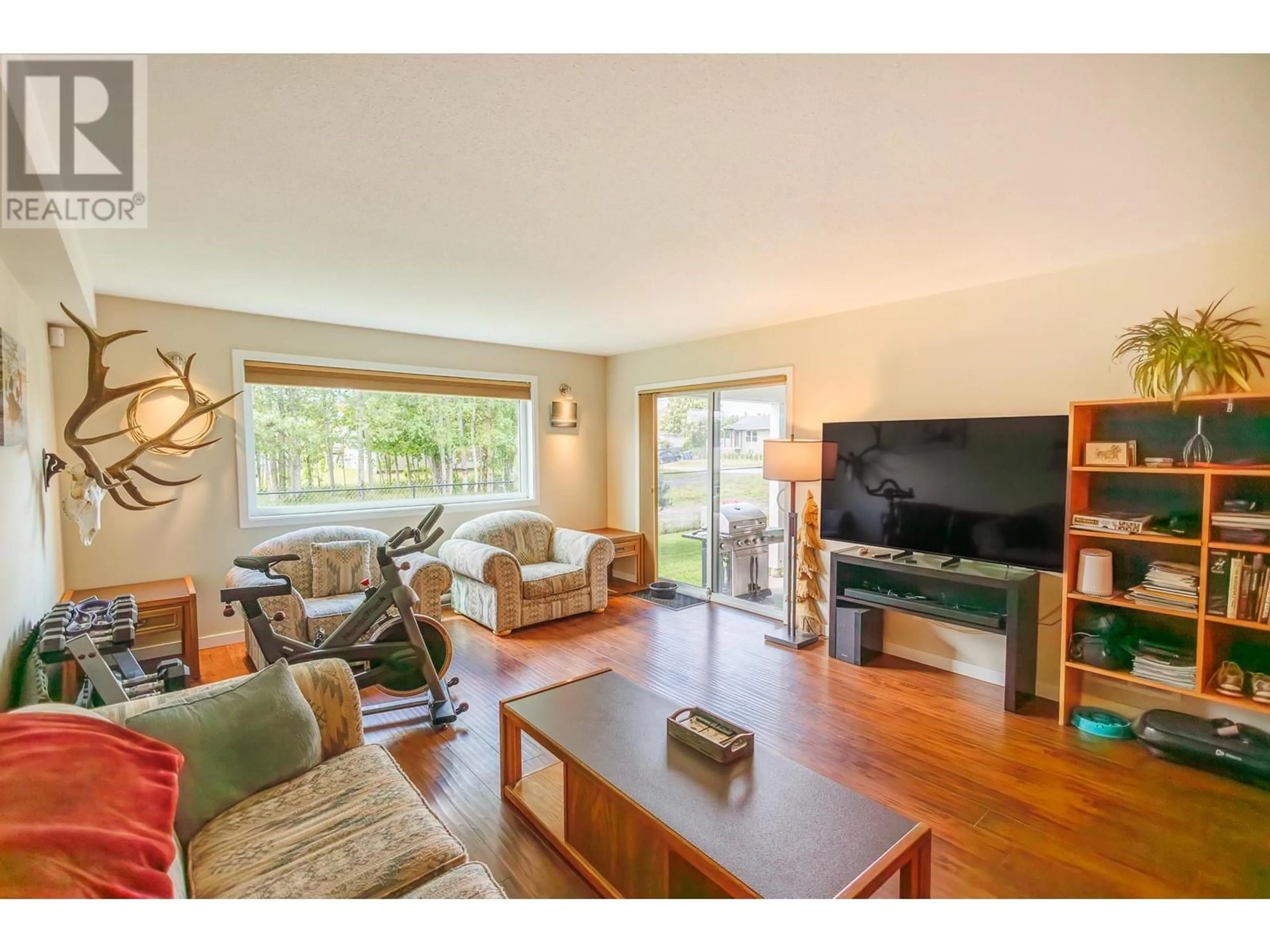 Living room with furniture, wood/laminate floor for 106 - 4719 DAVIS AVENUE, Terrace British Columbia V8G1Y1