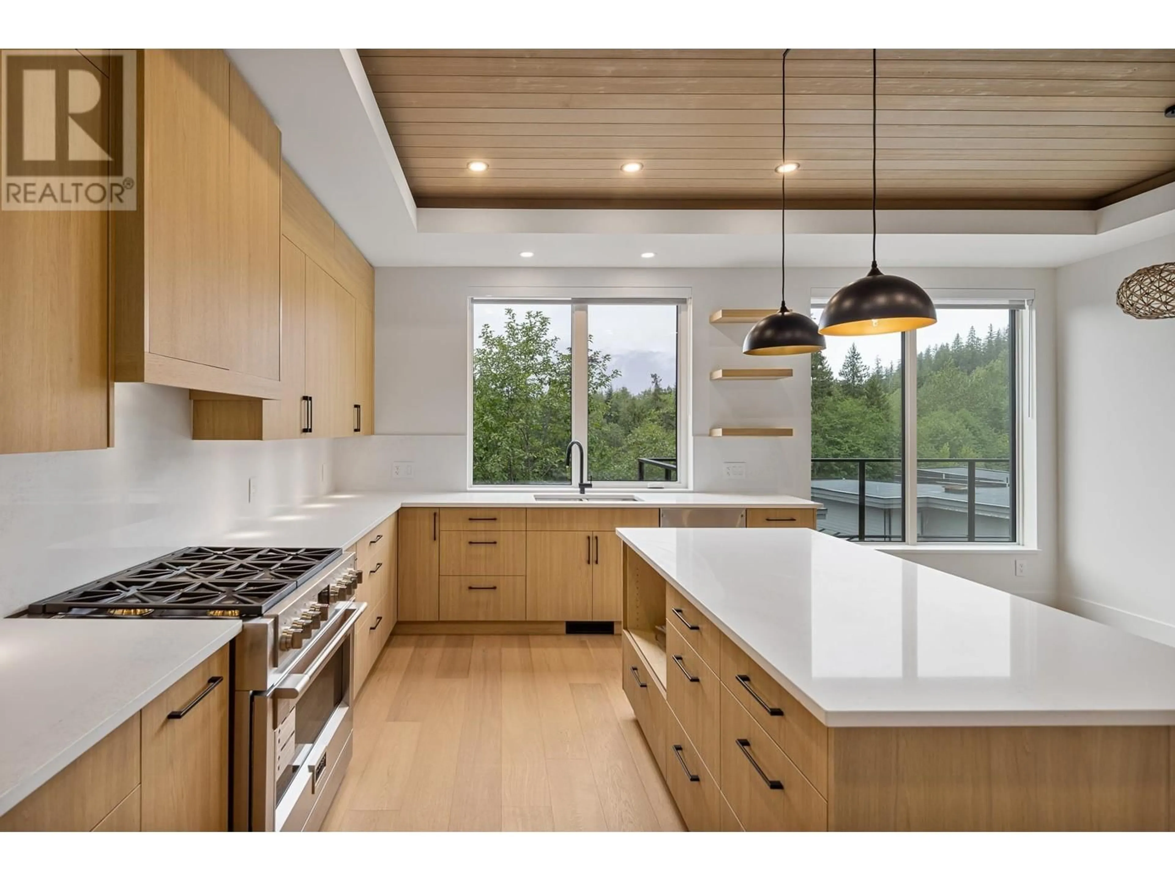 Open concept kitchen, wood/laminate floor for 15 - 3385 MAMQUAM ROAD, Squamish British Columbia V8B0E3
