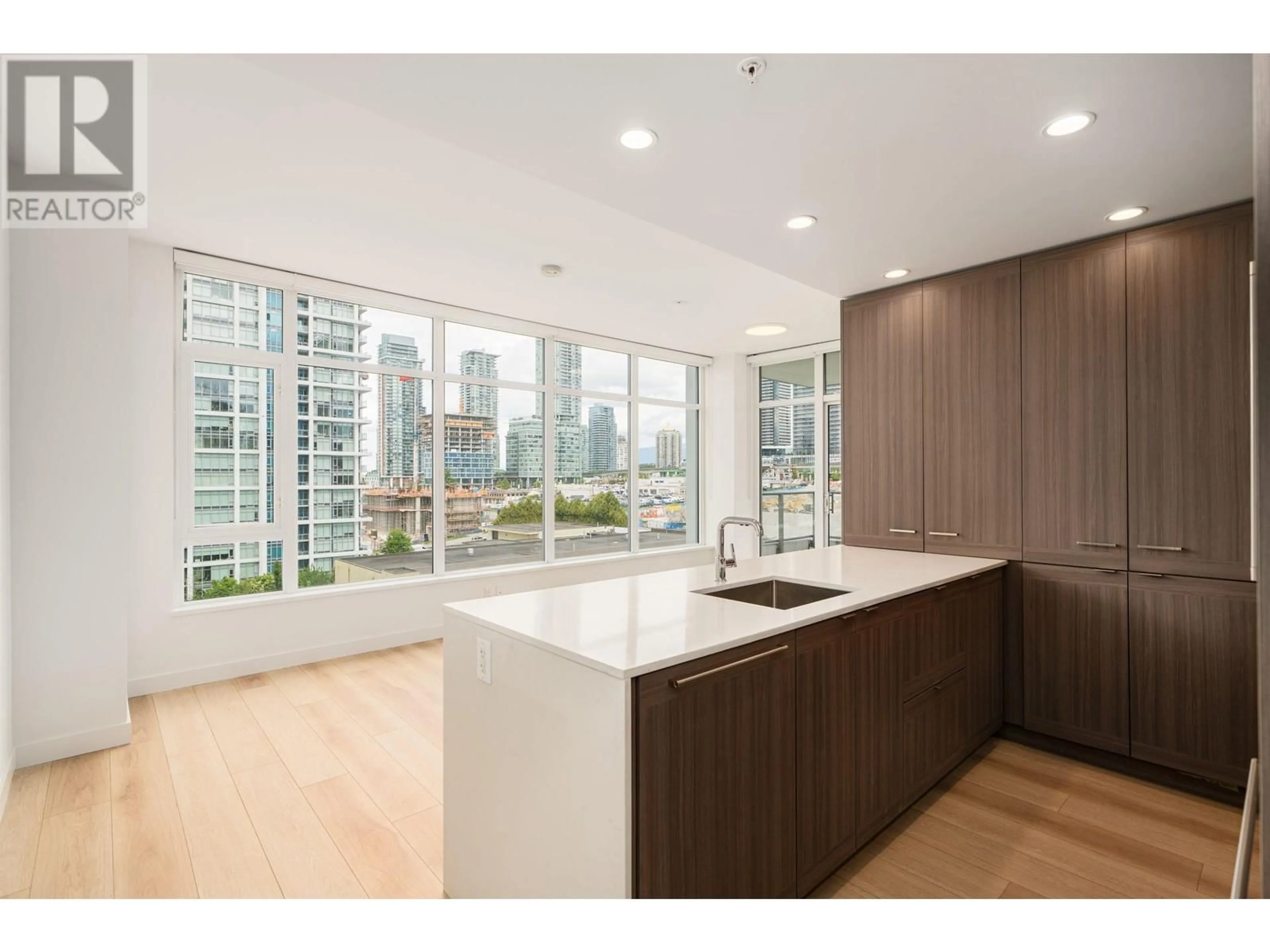 Open concept kitchen, wood/laminate floor for 1006 - 2351 BETA AVENUE, Burnaby British Columbia V5C0M2