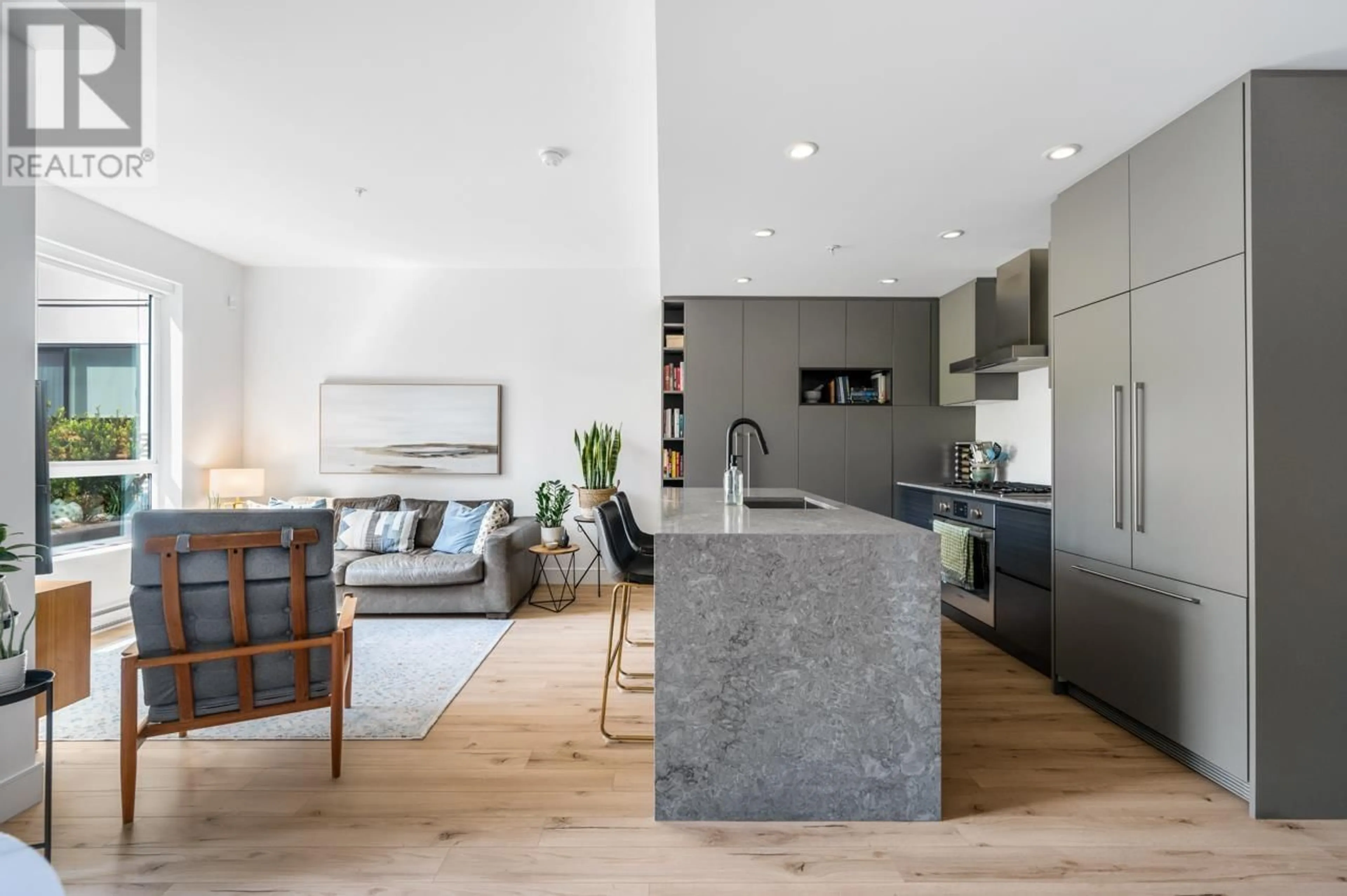 Open concept kitchen, cement floor for 206 - 3131 MURRAY STREET, Port Moody British Columbia V3H0L9