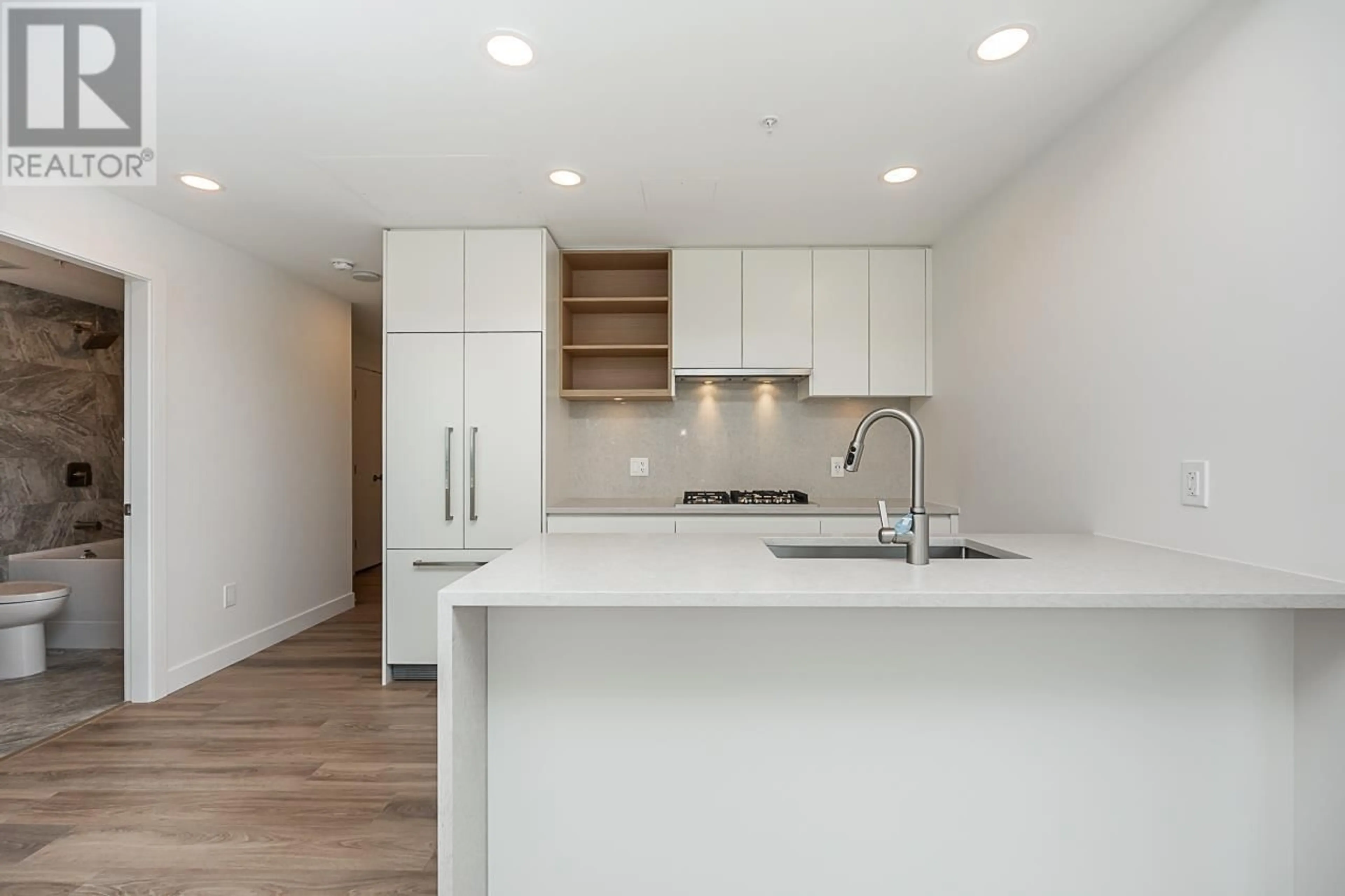 Open concept kitchen, wood/laminate floor for 1702 - 4433 ALASKA STREET, Burnaby British Columbia V5C5T3
