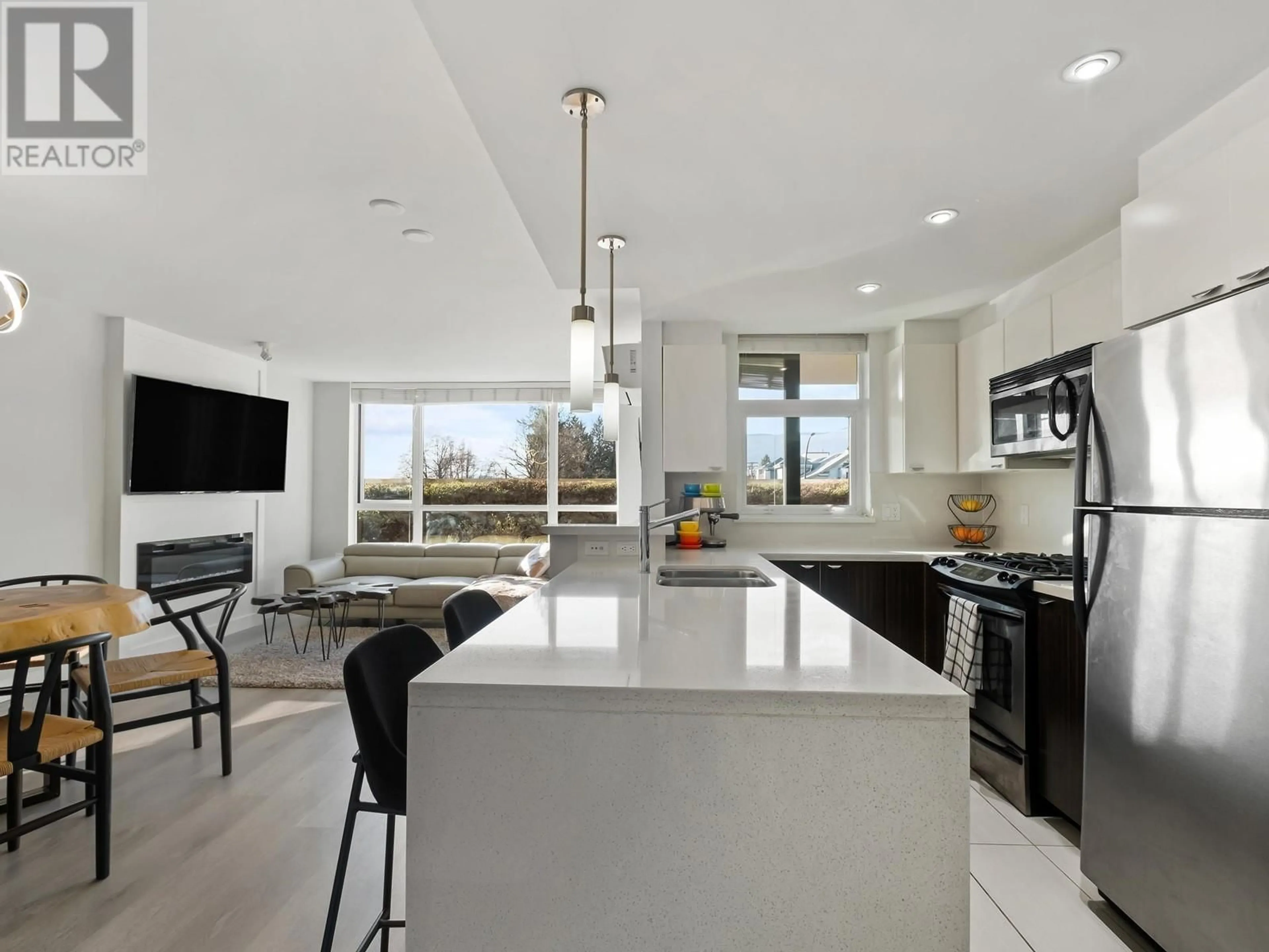 Open concept kitchen, ceramic/tile floor for 308 - 160 3RD STREET, North Vancouver British Columbia V7M0A9