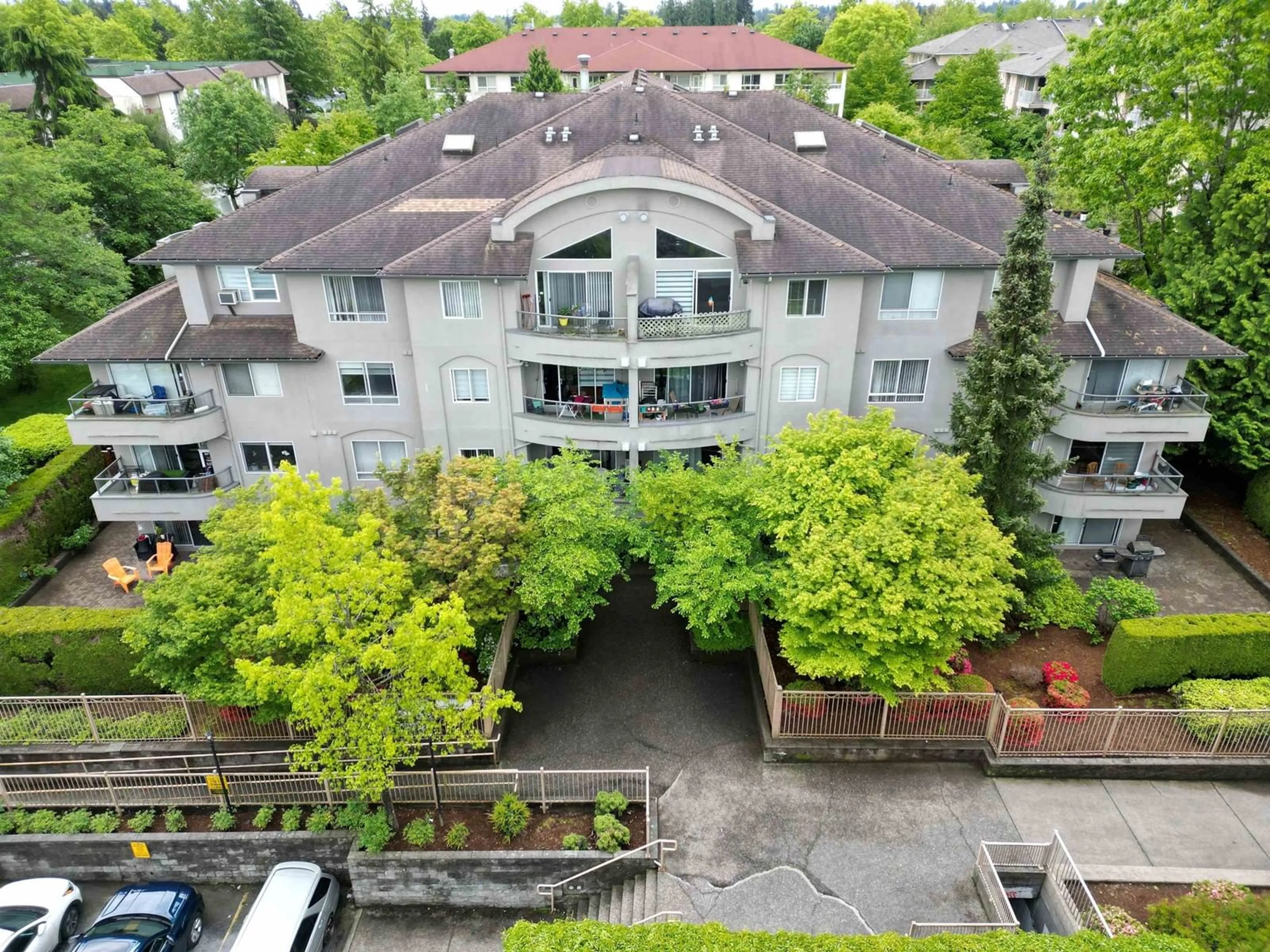 A pic from outside/outdoor area/front of a property/back of a property/a pic from drone, city buildings view from balcony for 407 - 7475 138, Surrey British Columbia V3W0Y9