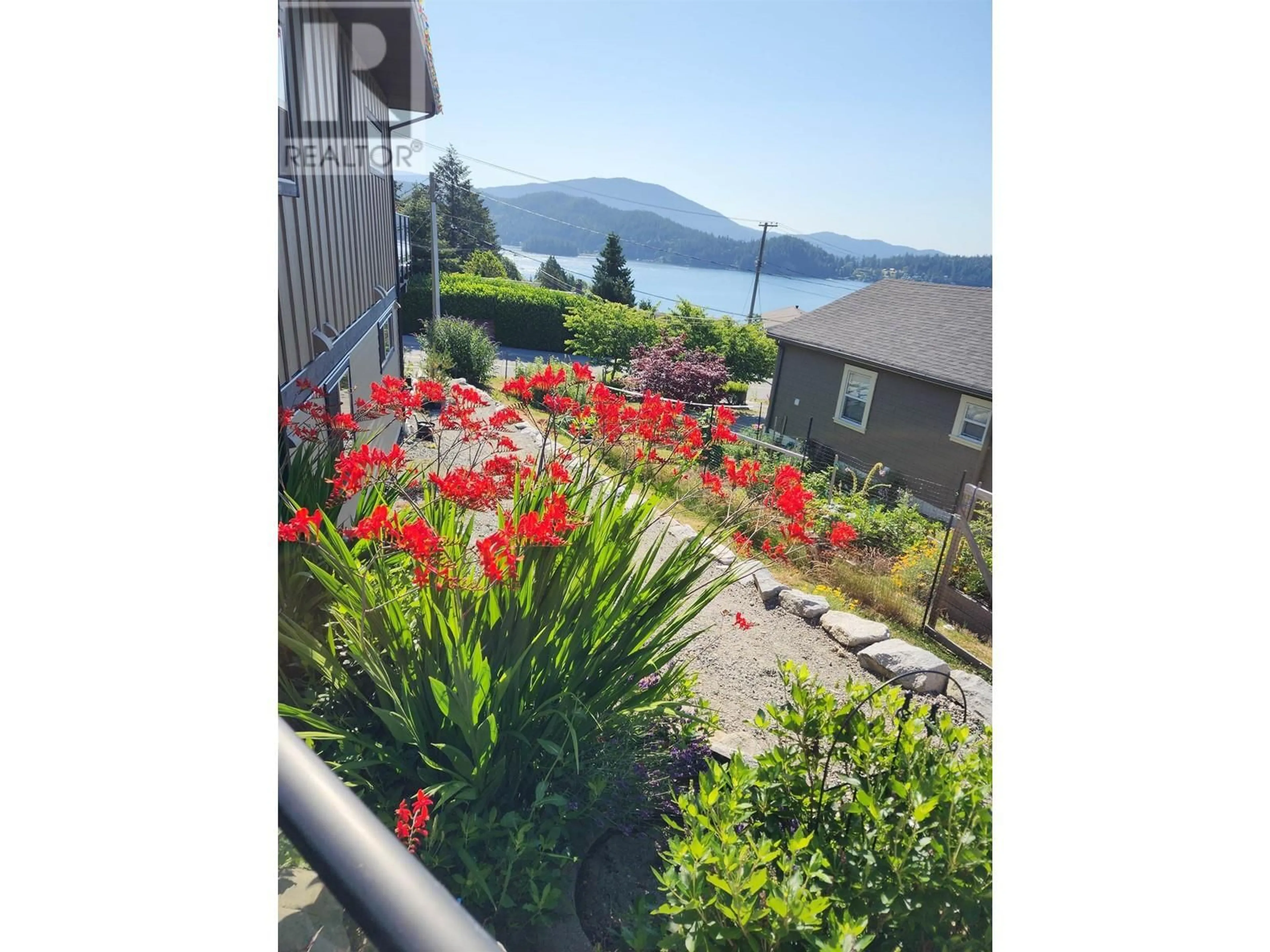 A pic from outside/outdoor area/front of a property/back of a property/a pic from drone, water/lake/river/ocean view for 659-661 GIBSONS WAY, Gibsons British Columbia V0N1V9