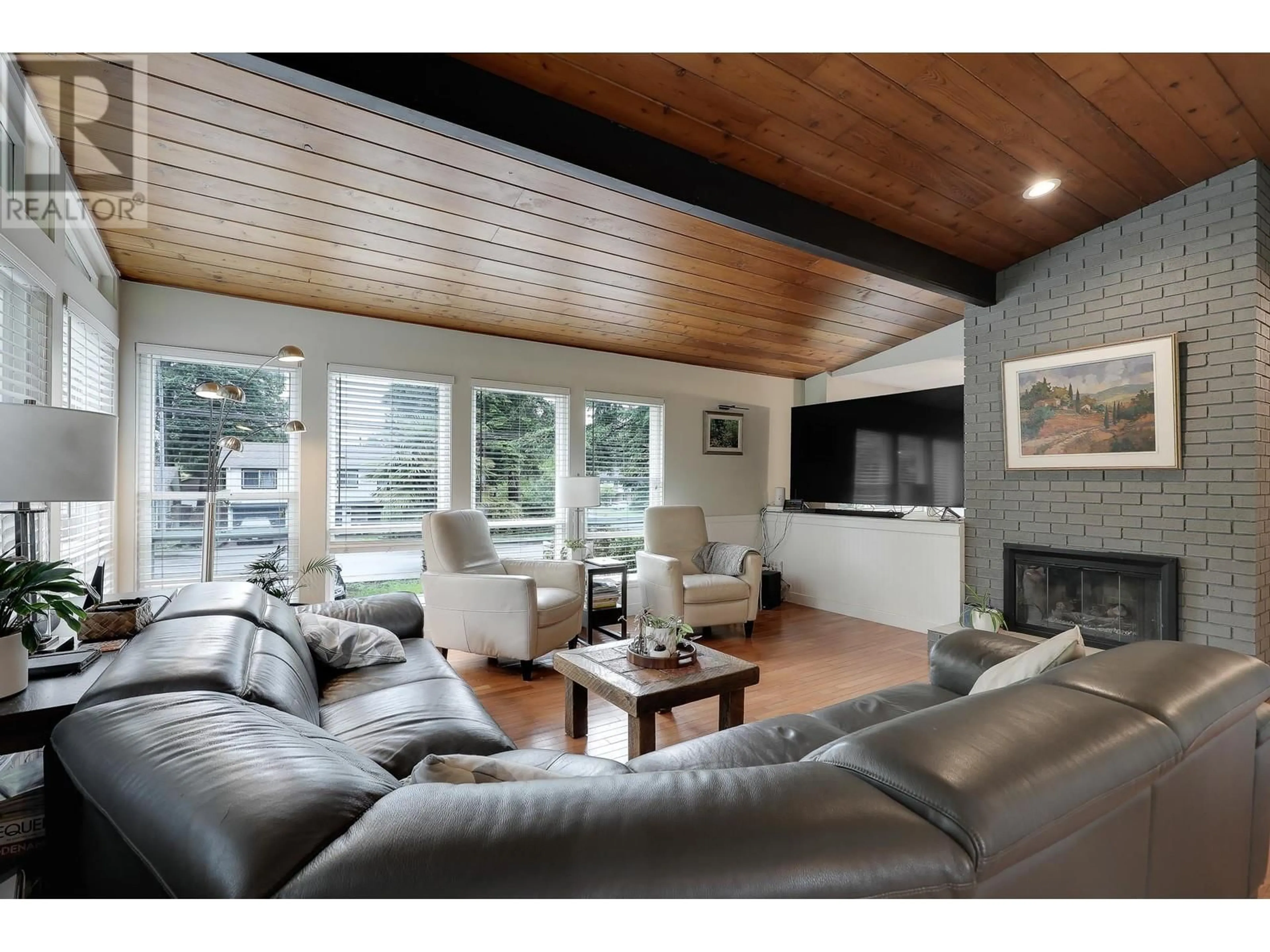 Living room with furniture, wood/laminate floor for 5156 8A AVENUE, Delta British Columbia V4M1T6