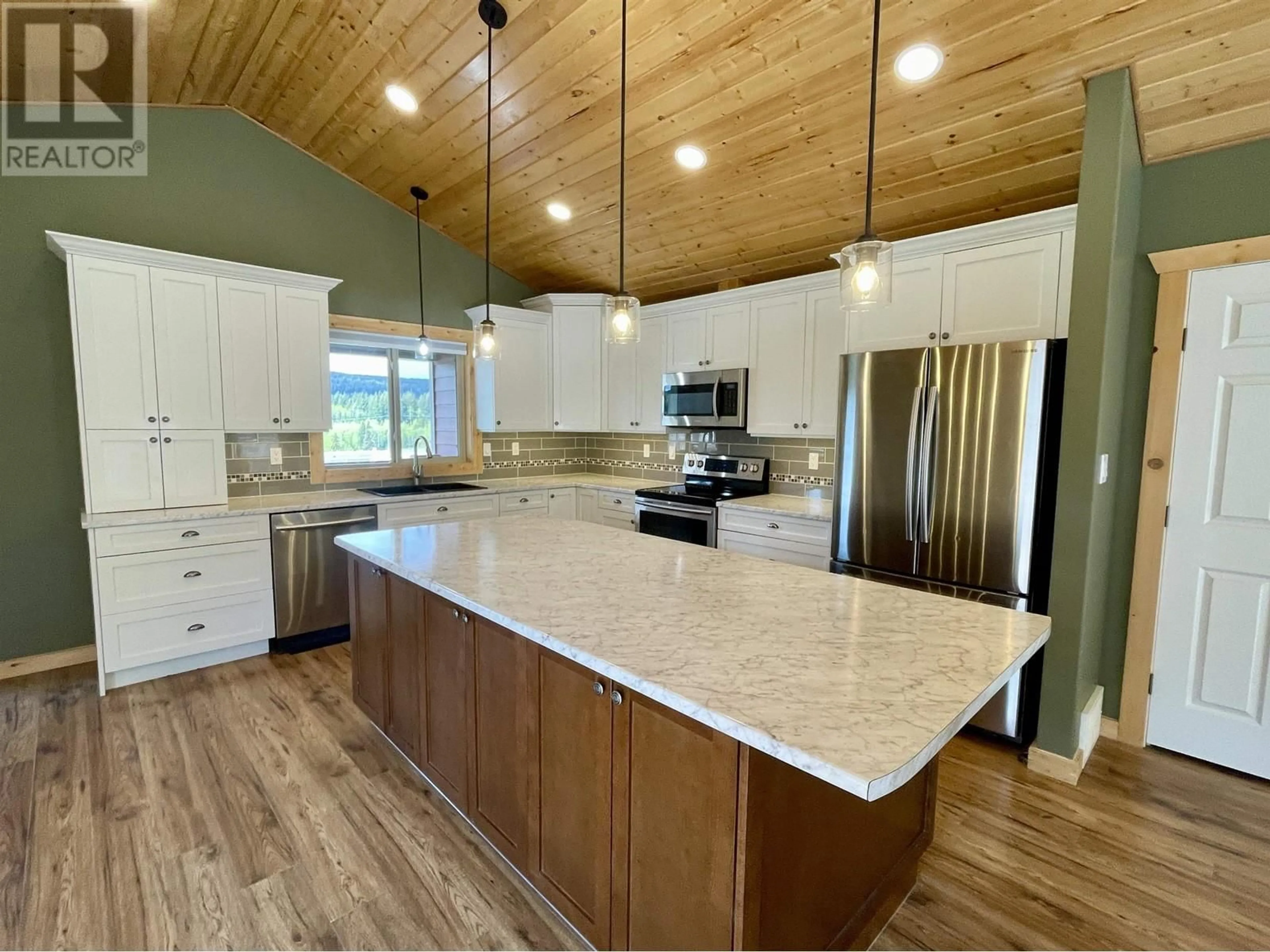 Open concept kitchen, unknown for 315 BLACKSTOCK ROAD, 100 Mile House British Columbia V0K2E0