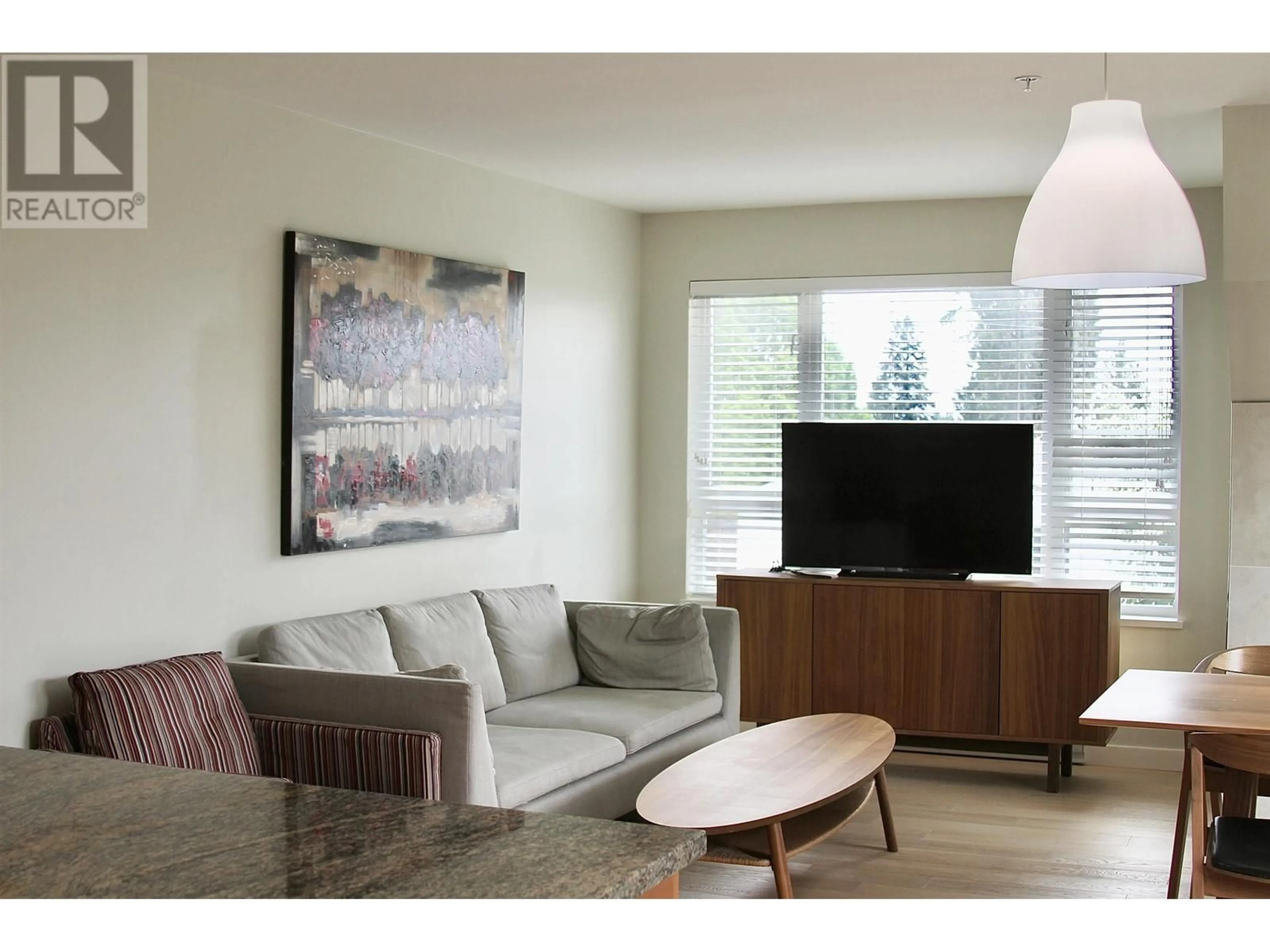 Living room with furniture, wood/laminate floor for 303 - 1880 57TH AVENUE, Vancouver British Columbia V6P1T7