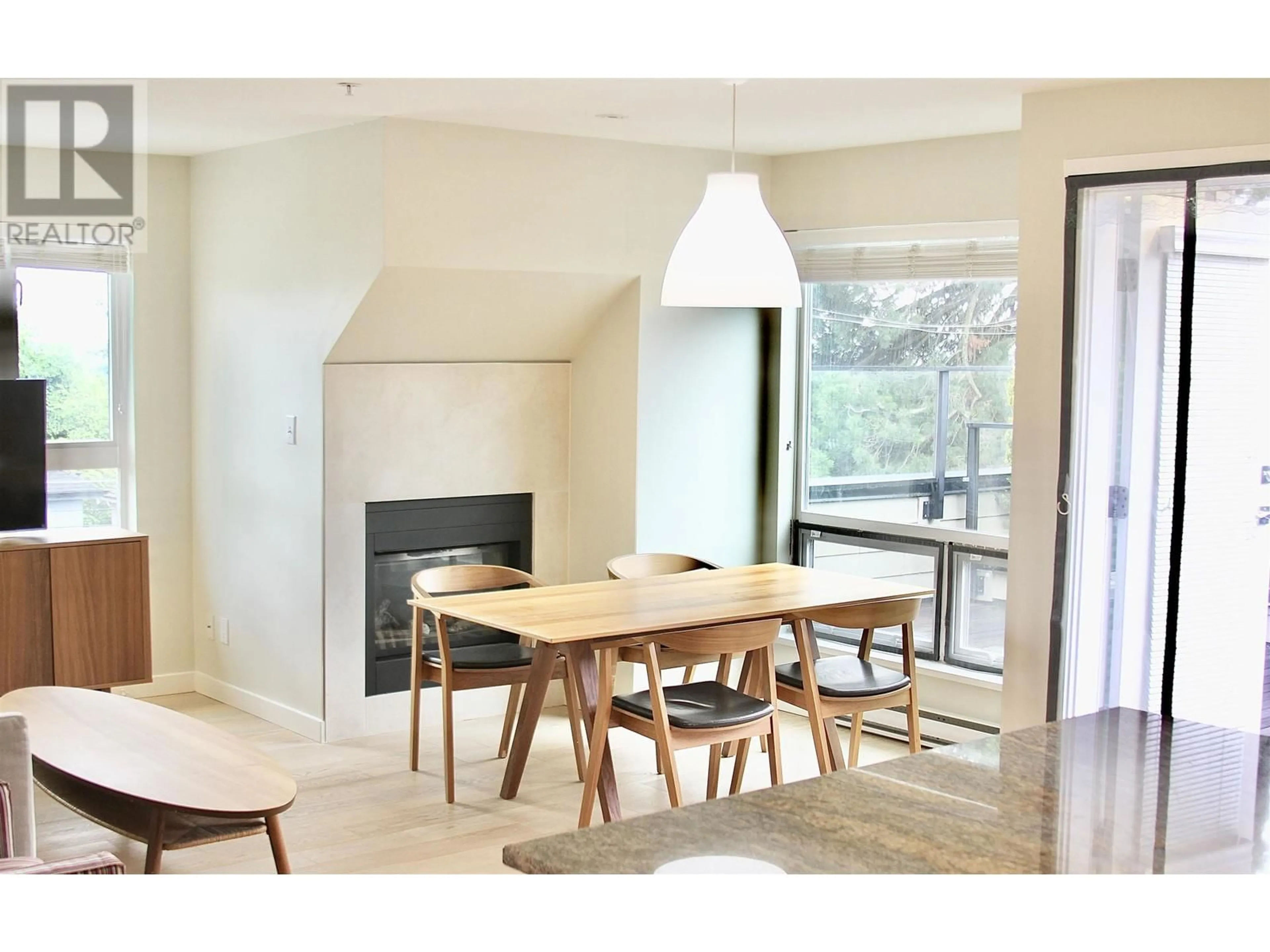 Dining room, wood/laminate floor for 303 - 1880 57TH AVENUE, Vancouver British Columbia V6P1T7