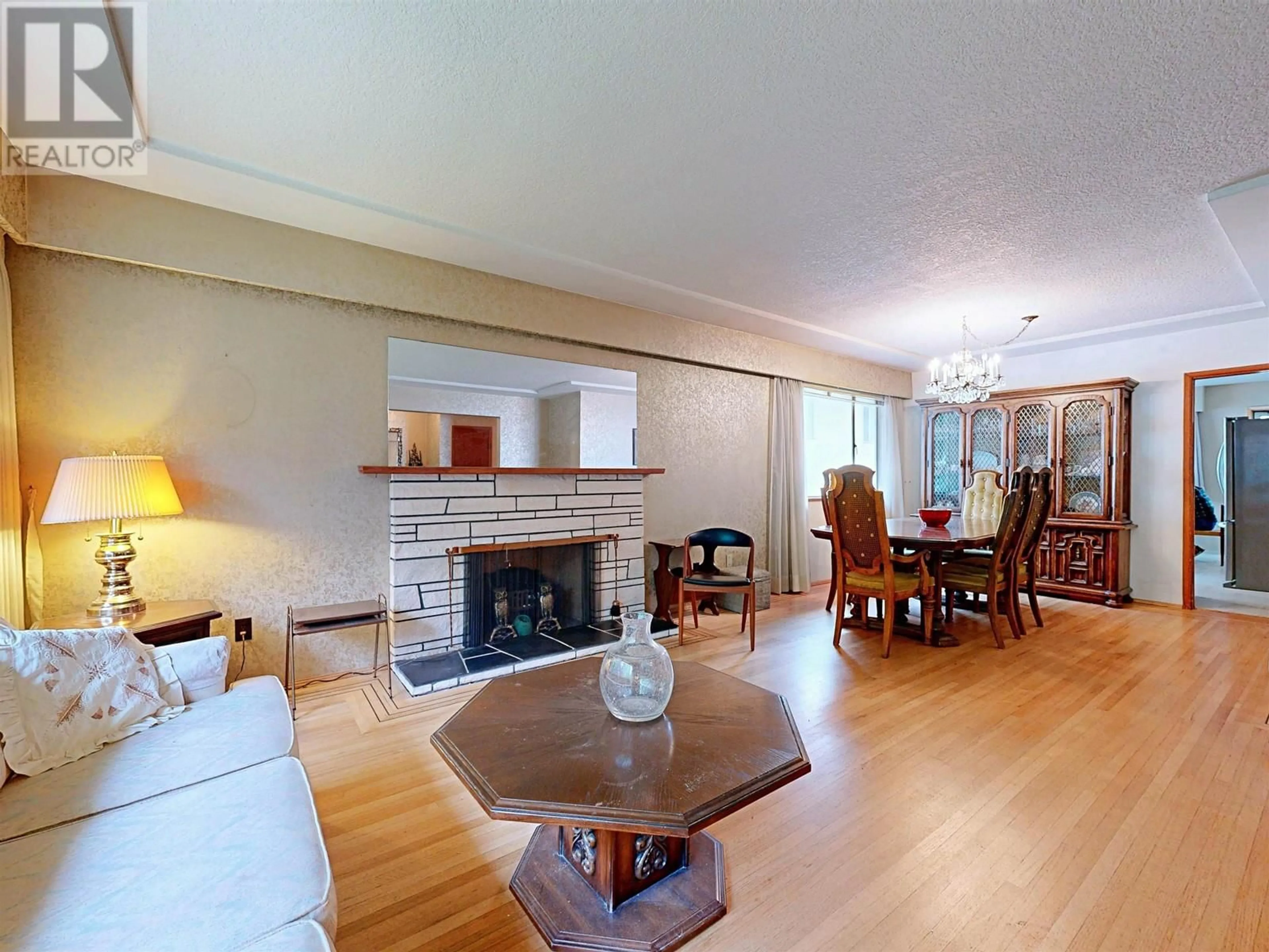 Living room with furniture, wood/laminate floor for 7269 CULLODEN STREET, Vancouver British Columbia V5X4K1