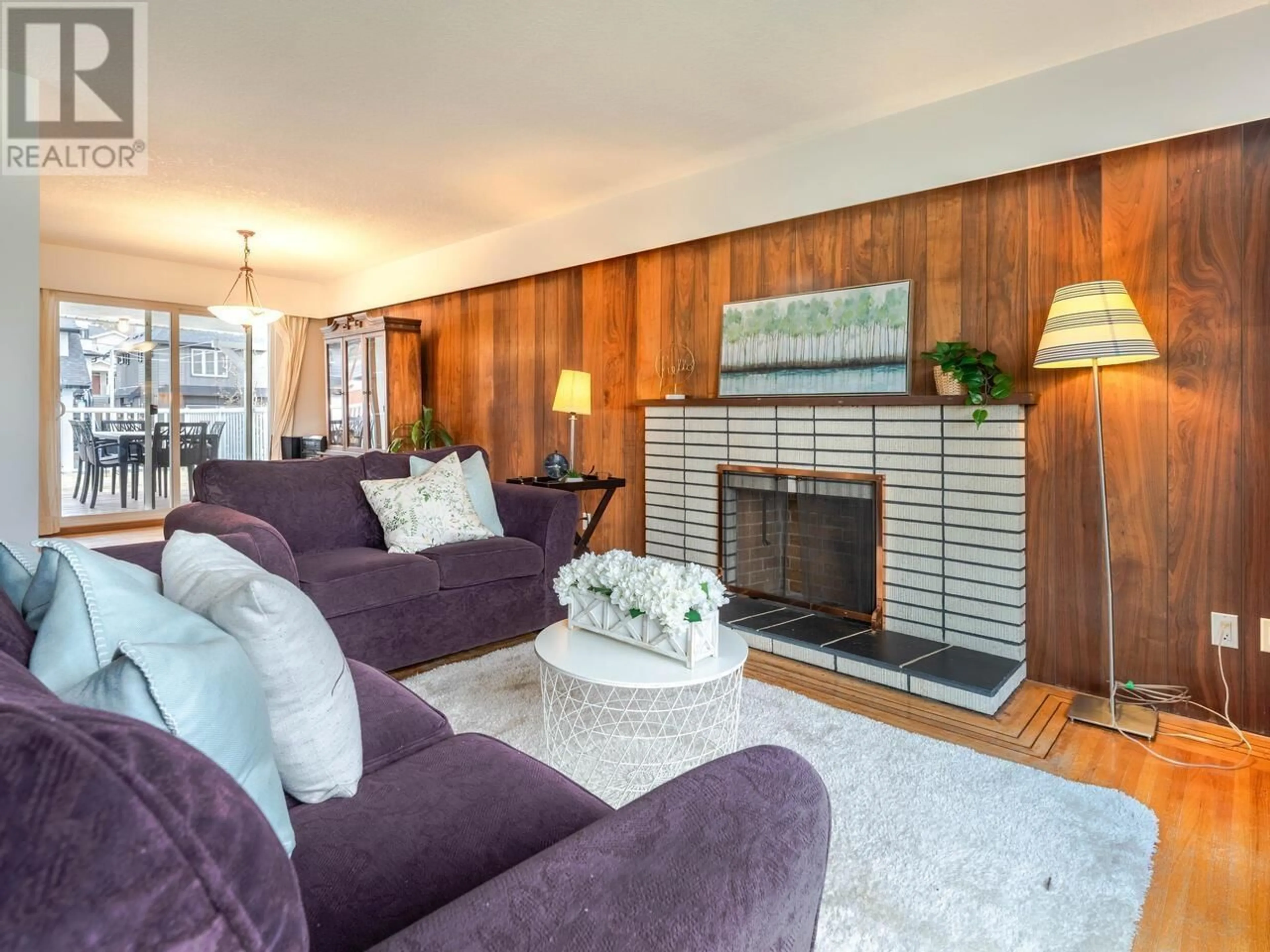 Living room with furniture, wood/laminate floor for 4754 EARLES STREET, Vancouver British Columbia V5R3R2