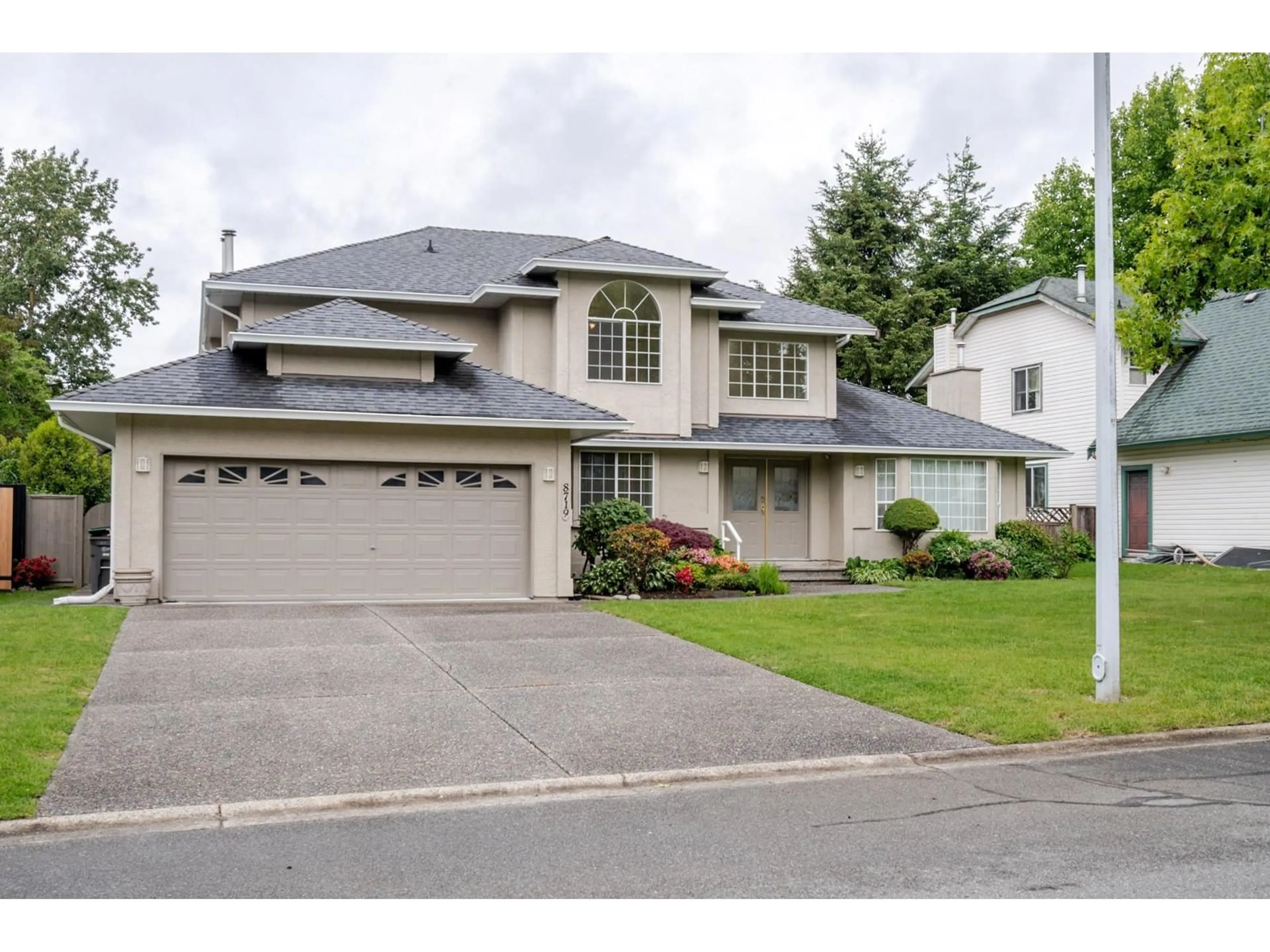 Home with vinyl exterior material, street for 8719 140B, Surrey British Columbia V3W0V9