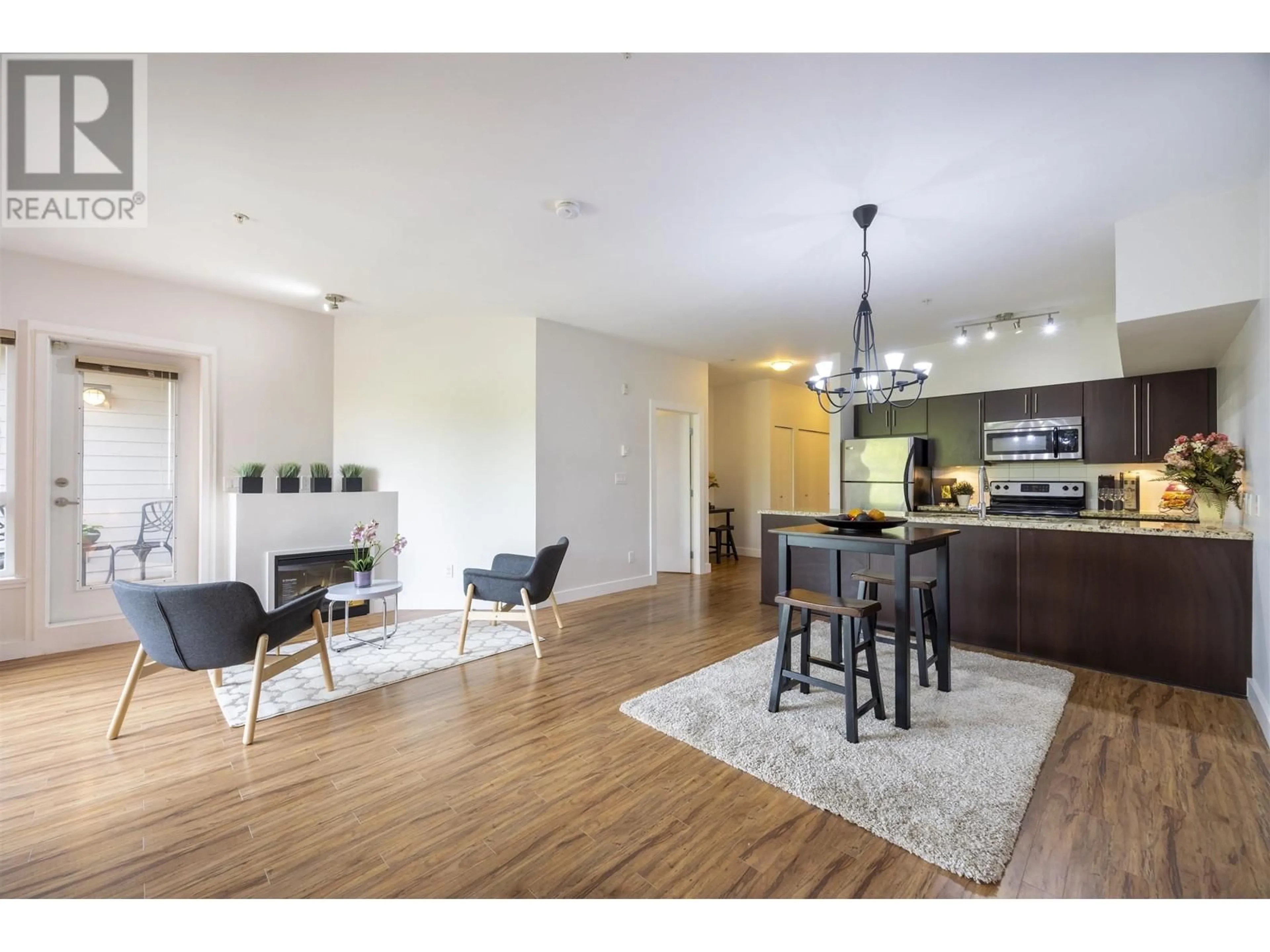 Open concept kitchen, wood/laminate floor for 305 - 7655 EDMONDS STREET, Burnaby British Columbia V3N1B6