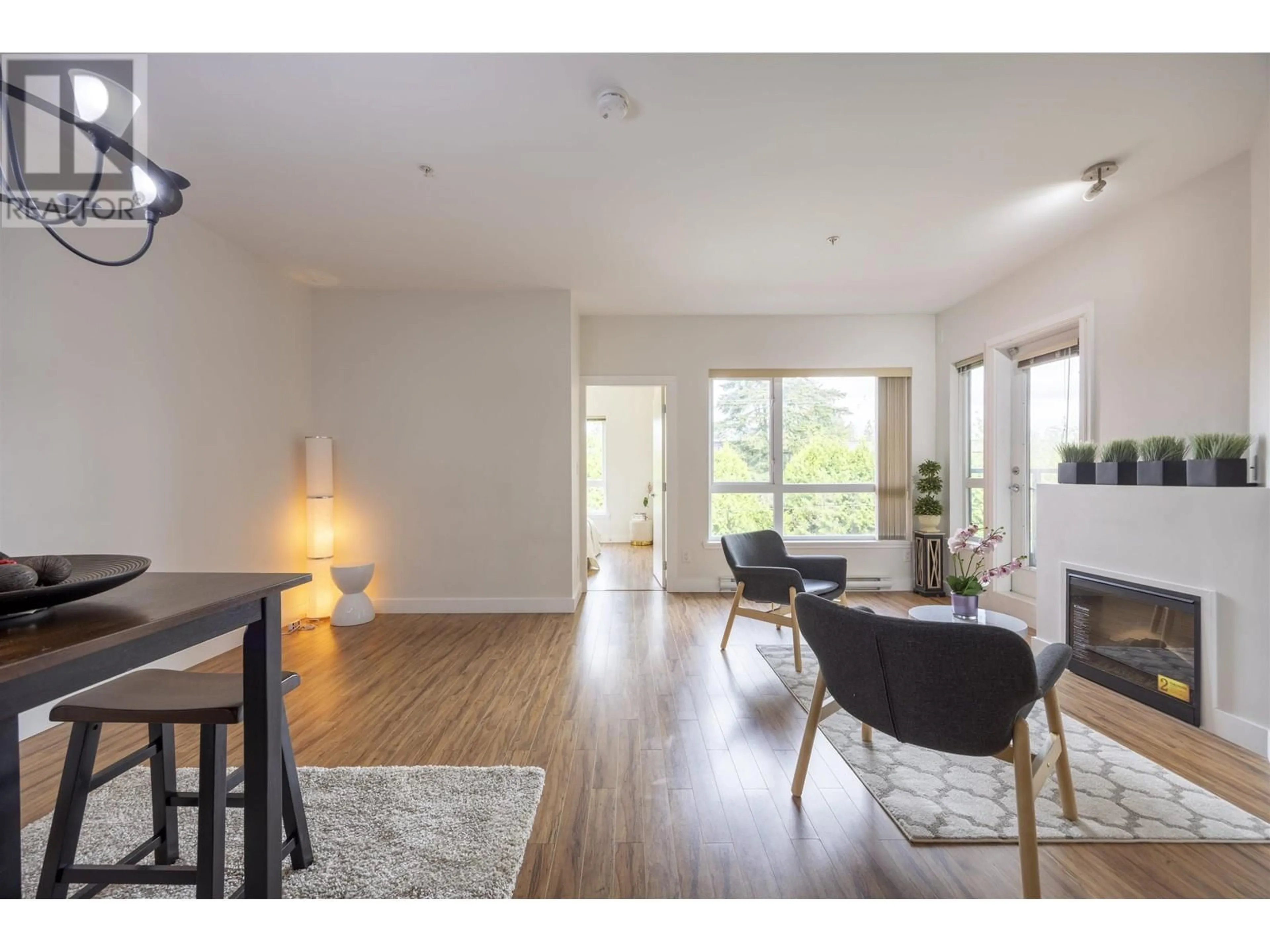 Living room with furniture, wood/laminate floor for 305 - 7655 EDMONDS STREET, Burnaby British Columbia V3N1B6