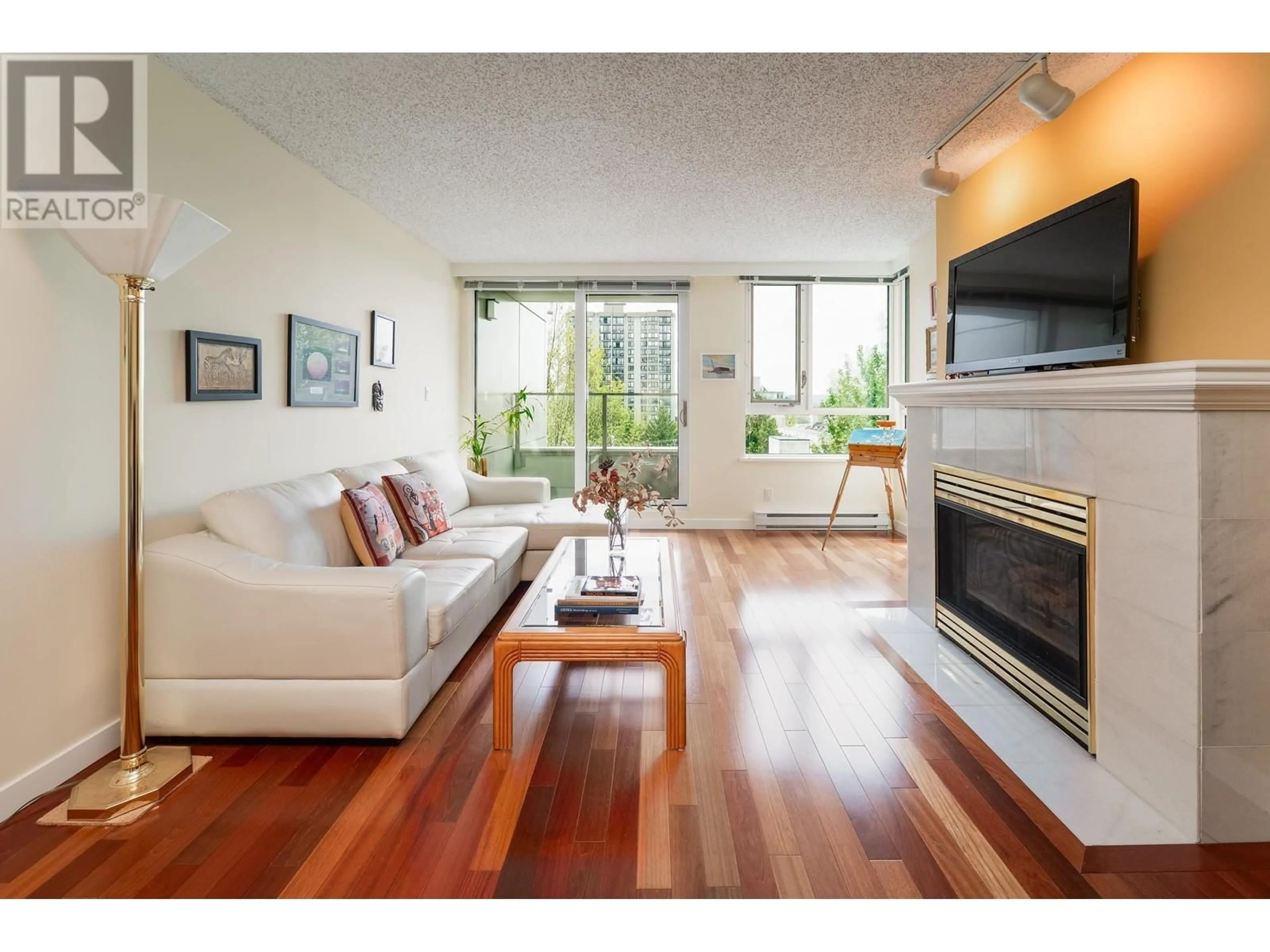 Living room with furniture, wood/laminate floor for 501 - 1345 BURNABY STREET, Vancouver British Columbia V6E1R2