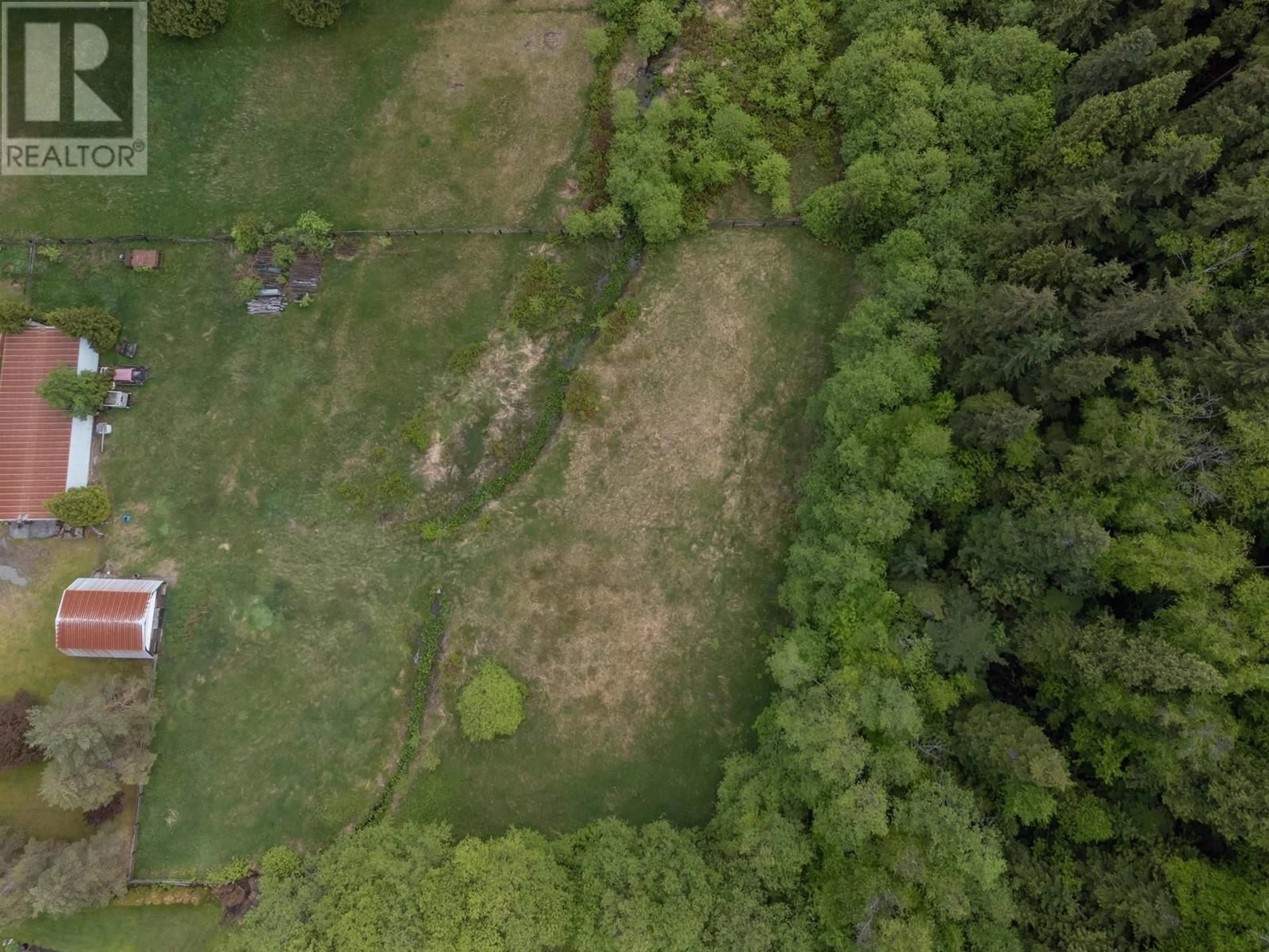 A pic from outside/outdoor area/front of a property/back of a property/a pic from drone, forest/trees view for 4670 LOWRIE AVENUE, Terrace British Columbia V8G3Z1