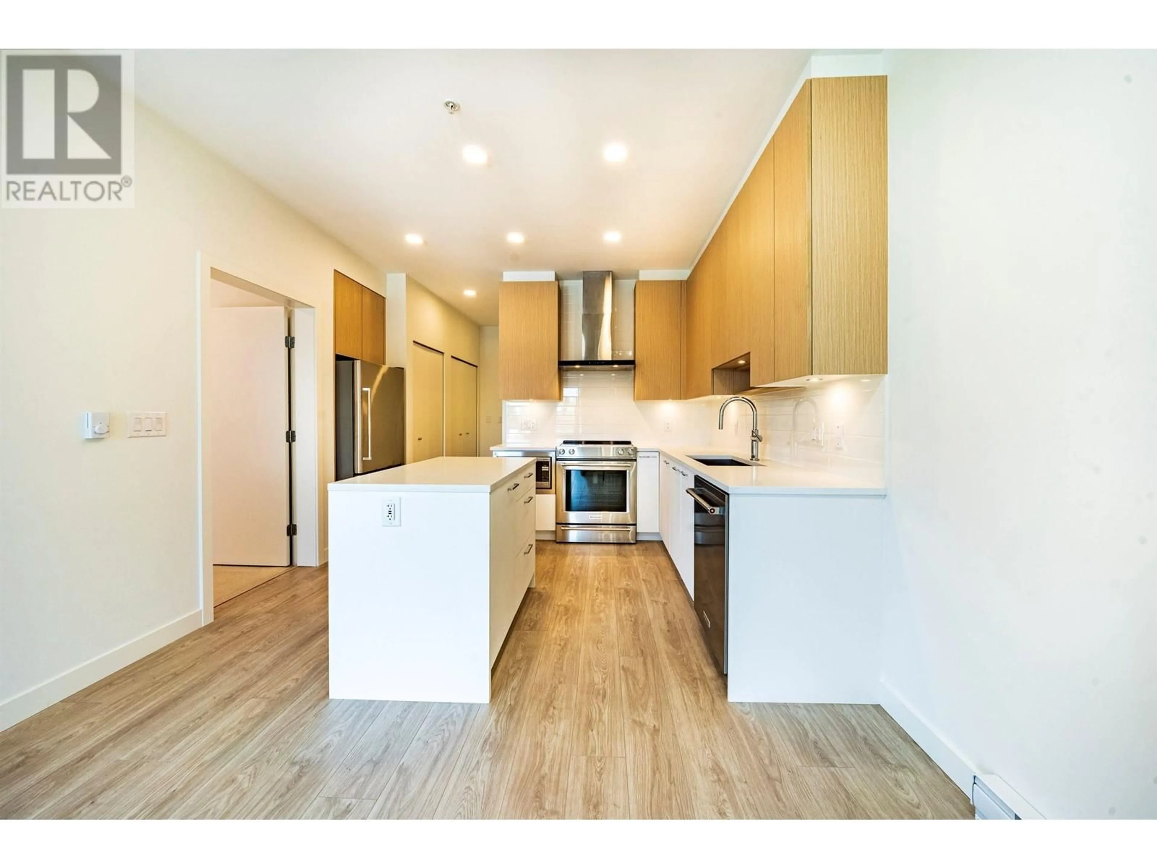 Open concept kitchen, wood/laminate floor for 406 - 7599 15TH STREET, Burnaby British Columbia V3N0H9