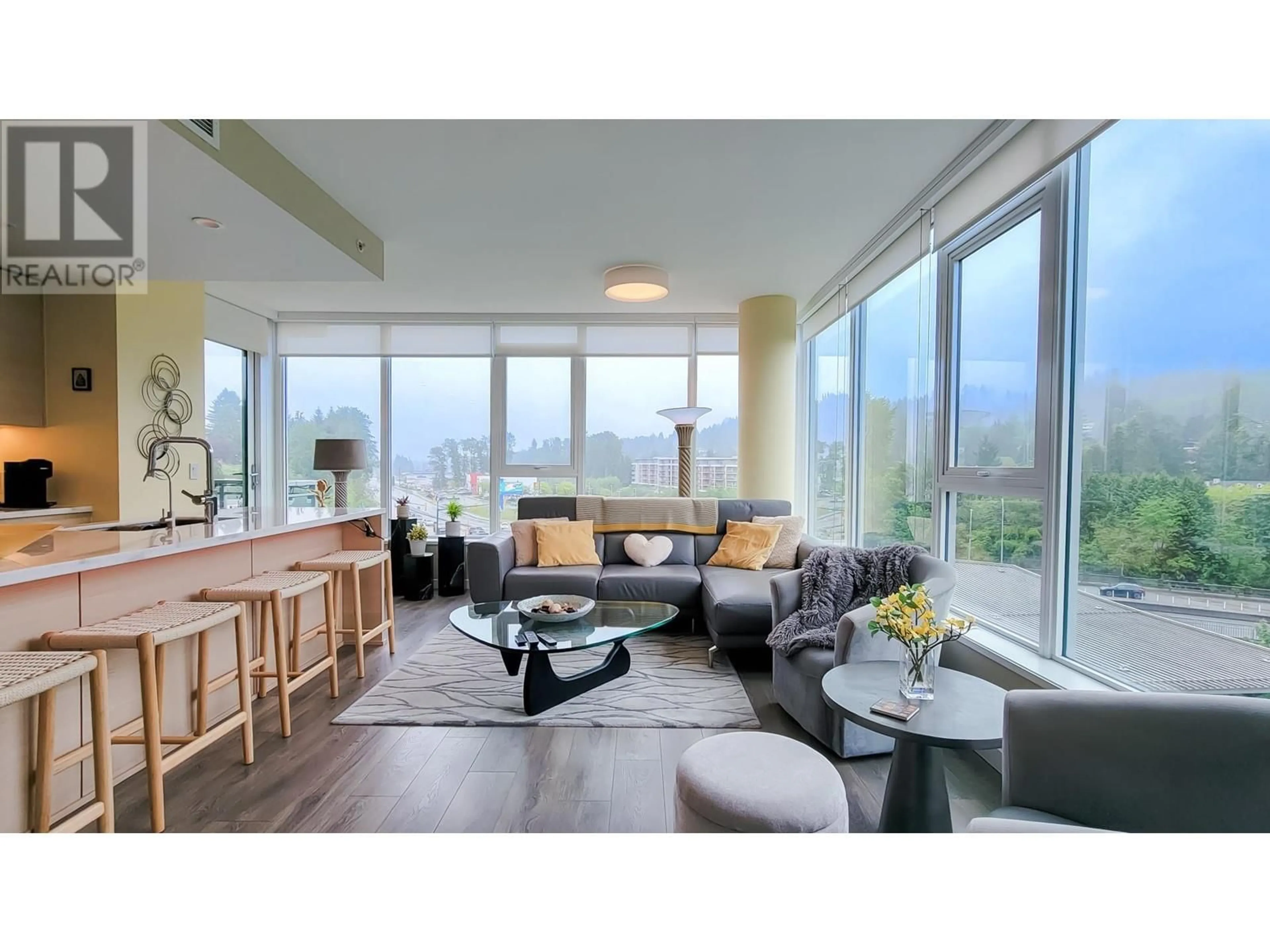 Living room with furniture, unknown for 1004 - 308 MORRISSEY ROAD, Port Moody British Columbia V3H0M2