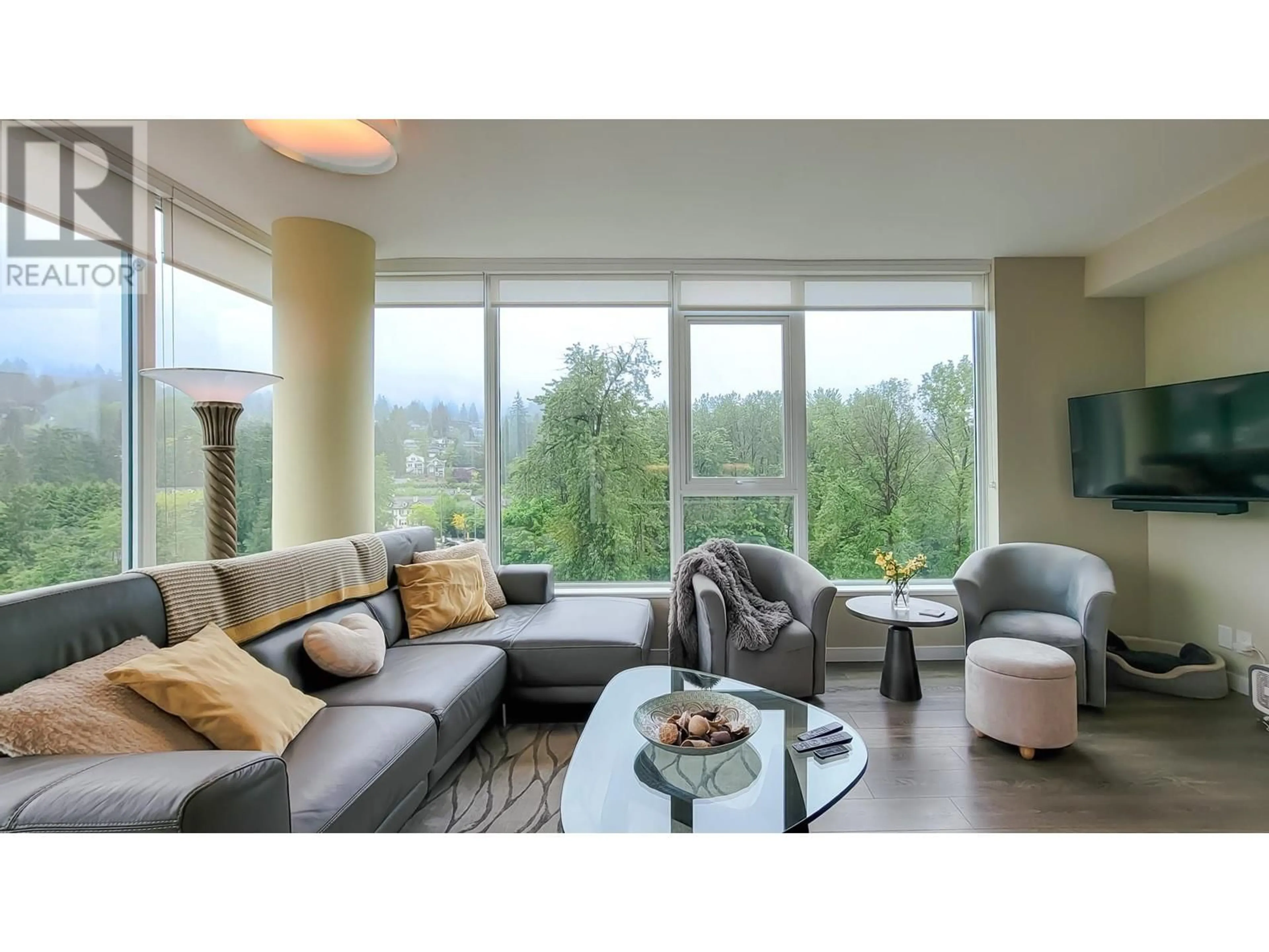 Living room with furniture, wood/laminate floor for 1004 - 308 MORRISSEY ROAD, Port Moody British Columbia V3H0M2