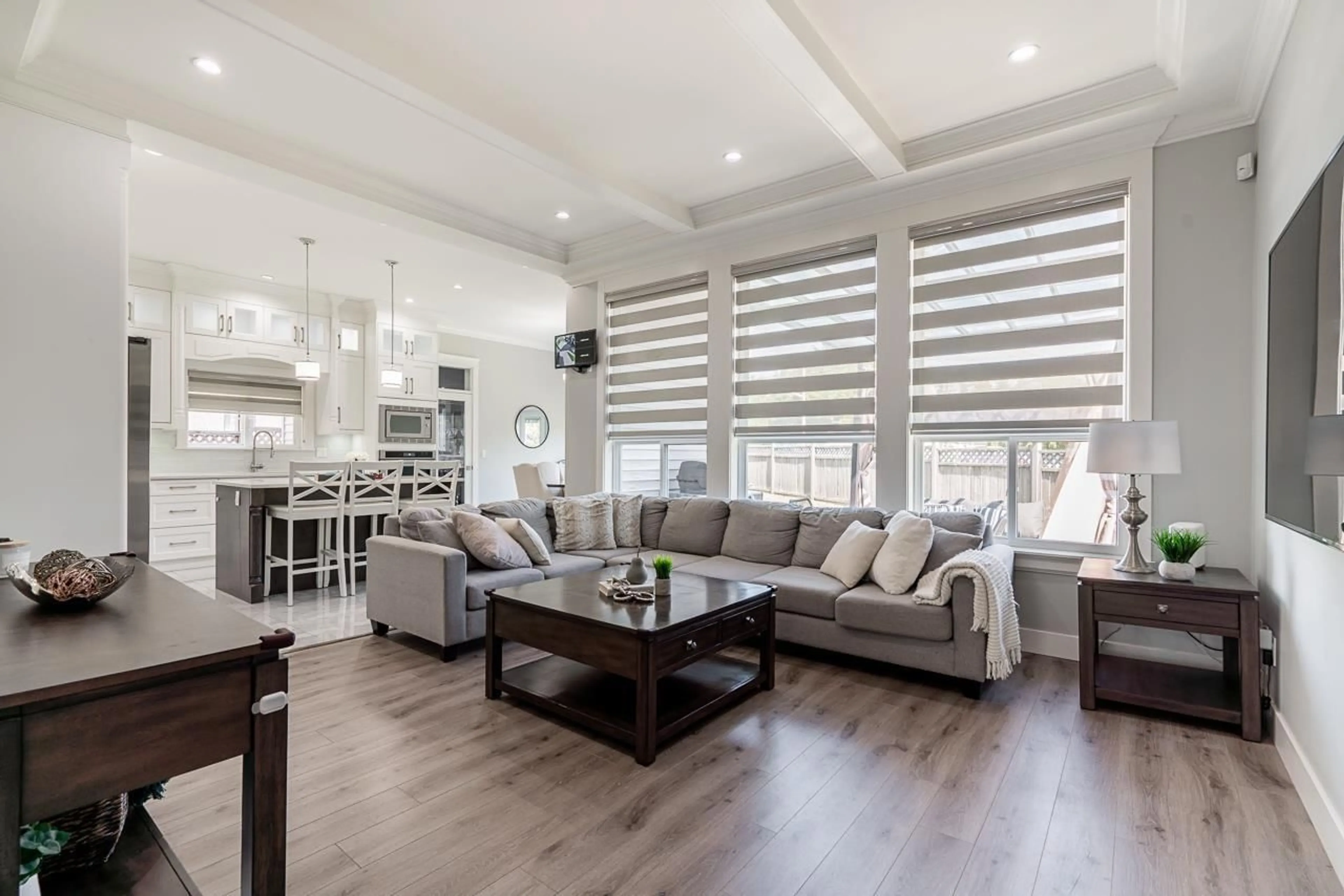 Living room with furniture, wood/laminate floor for 19381 62, Surrey British Columbia V3S7L4