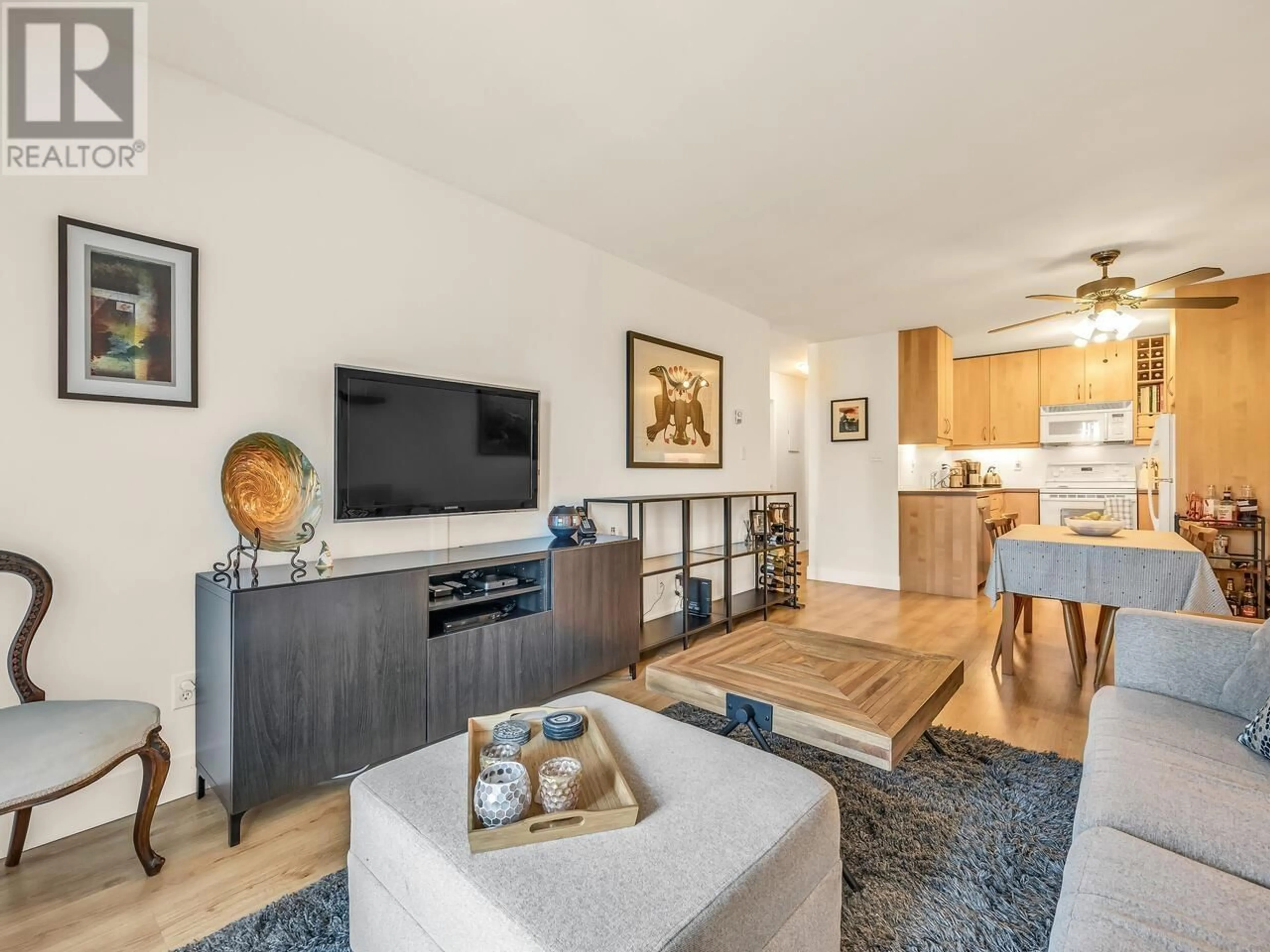 Living room with furniture, wood/laminate floor for 206 - 251 4TH STREET, North Vancouver British Columbia V7M1H8