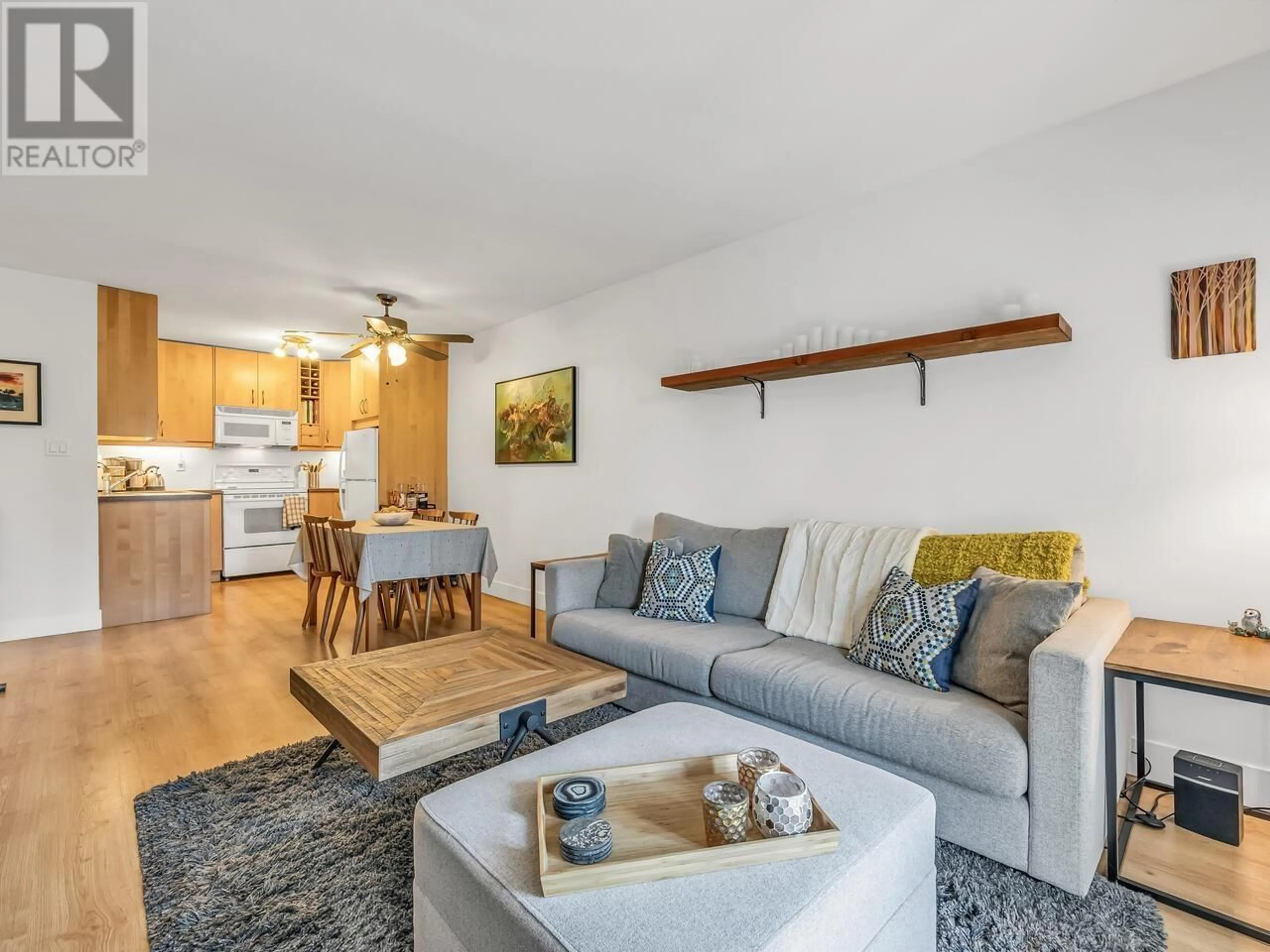 Living room with furniture, wood/laminate floor for 206 - 251 4TH STREET, North Vancouver British Columbia V7M1H8