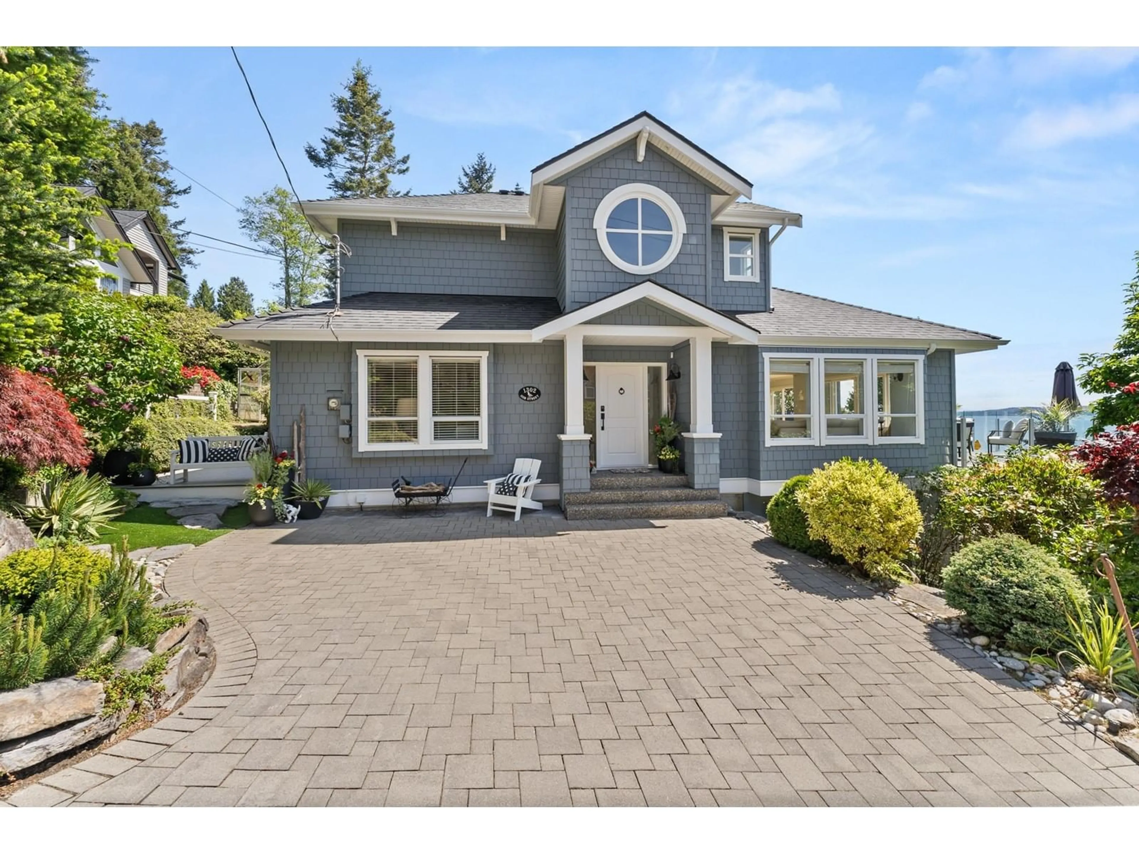 Home with vinyl exterior material, street for 1302 132B, Surrey British Columbia V4A4C3