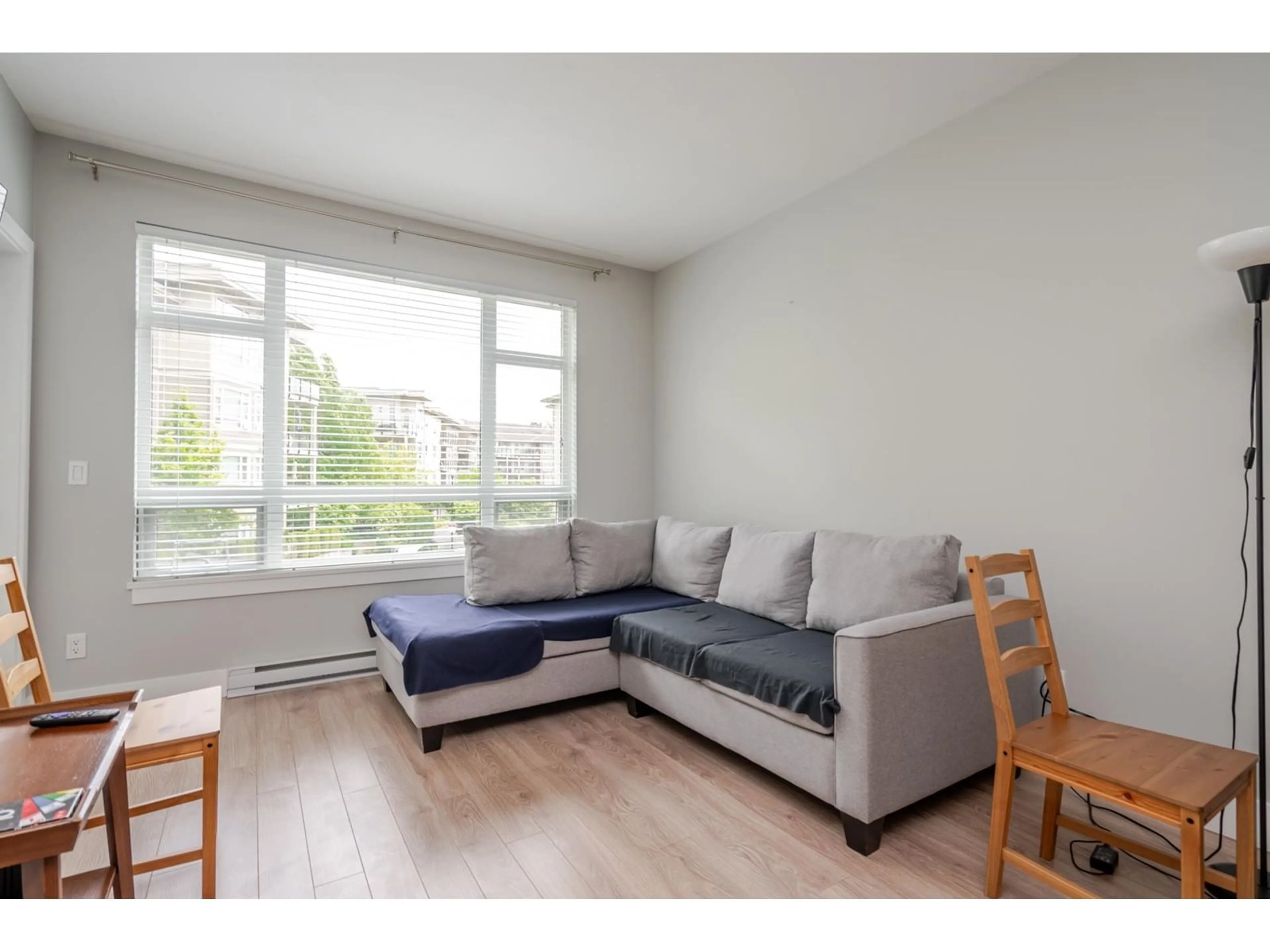 Living room with furniture, wood/laminate floor for C225 - 20211 66, Langley British Columbia V2Y0L4